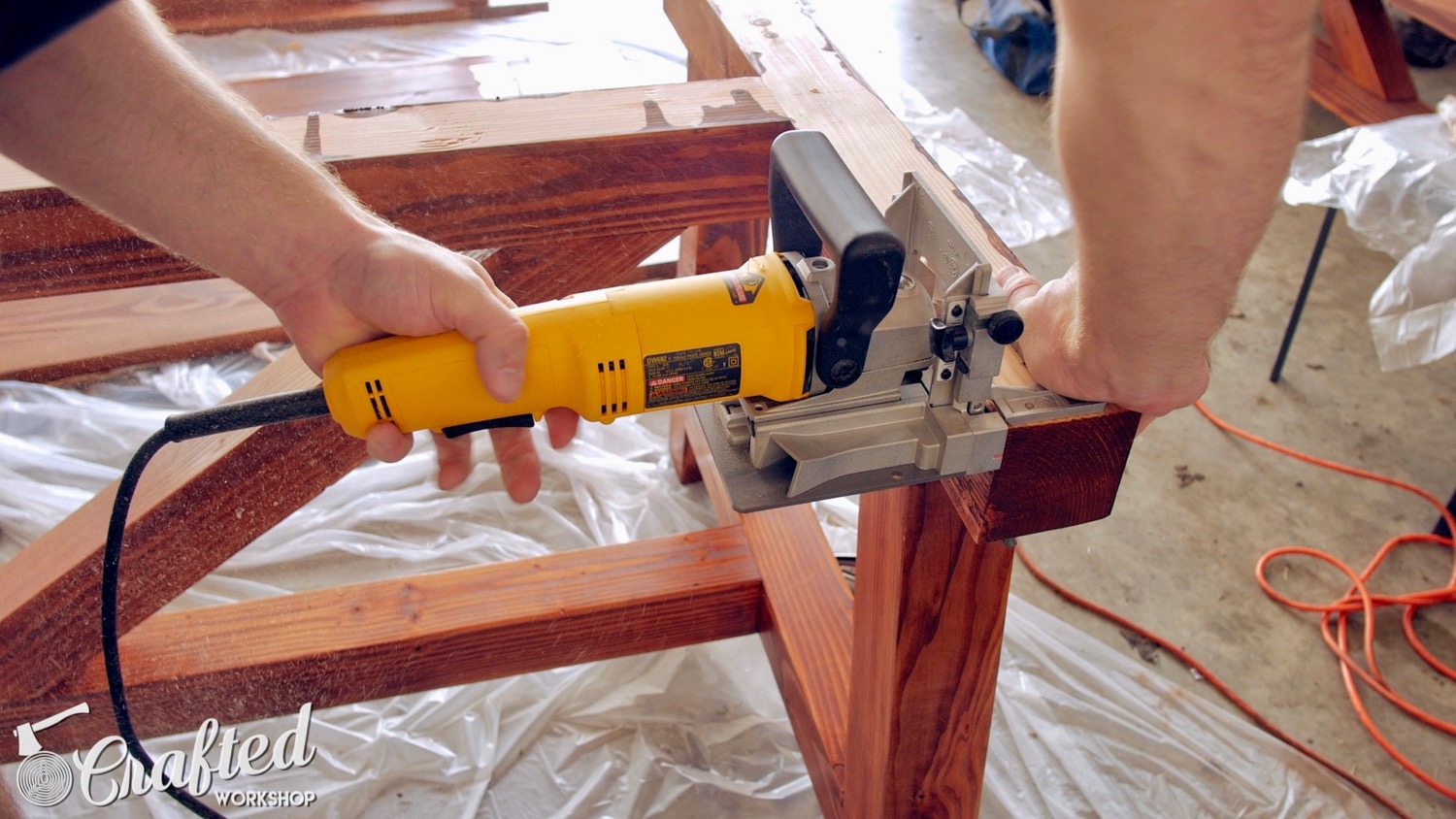 Cutting slots for the table top fasteners using a biscuit joiner.