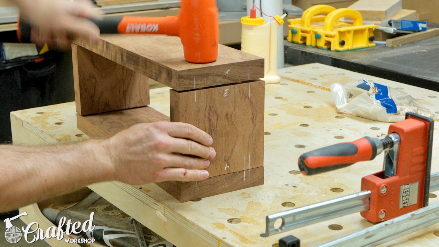 Assembling floating shelf using dowel pins.
