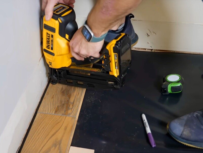 Anyway, I repeated the process for the third board in the row and then I could install the final board. I needed to cut the board to length to fit, and the way I like to mark the length on these boards is to use a spacer against the wall, a scrap pi…