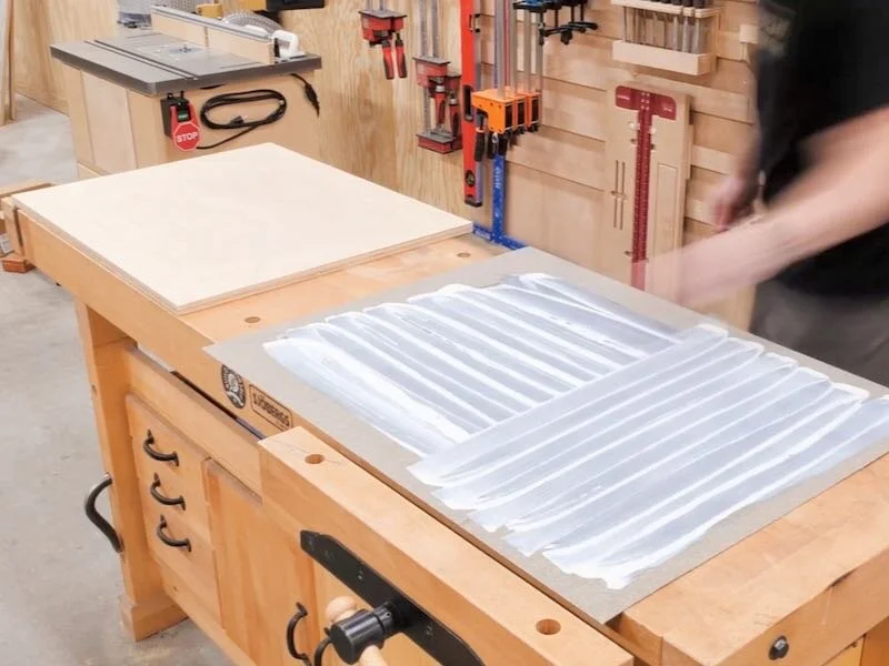 Adding contact cement to both faces of the parts to be adhered of the crosscut sled.