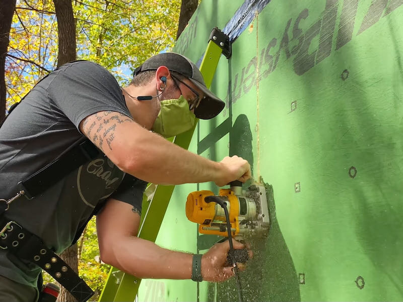 Cutting window openings with router once the wall is up.