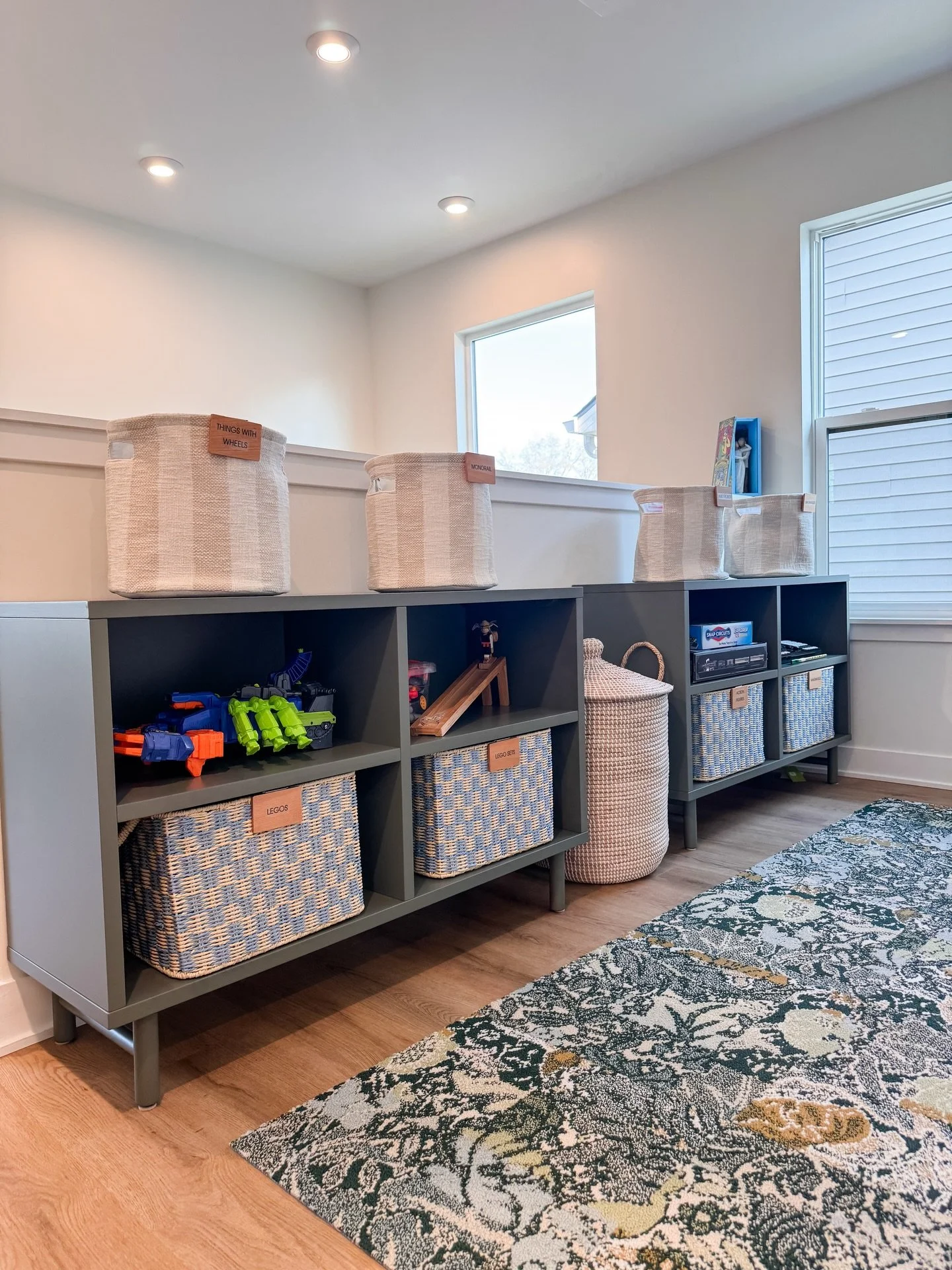 If this space doesn&rsquo;t inspire P L A Y, we&rsquo;re not sure what does! When our client reached out, she had two major goals:

1) Move toys out of the bedroom and into this sweet little top of the stairs nook.

2) Keep the tree bookshelf, but so