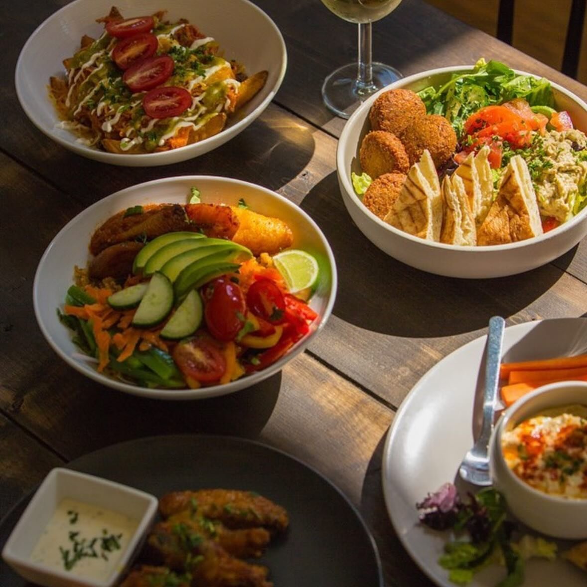 Something for everyone. 
-
Our menu offers a variety of delicious dishes from around the world that cater to vegans, vegetarians, and meat-eaters alike. You can enjoy our simple yet story-worthy meals that are sure to satisfy your cravings. We are op