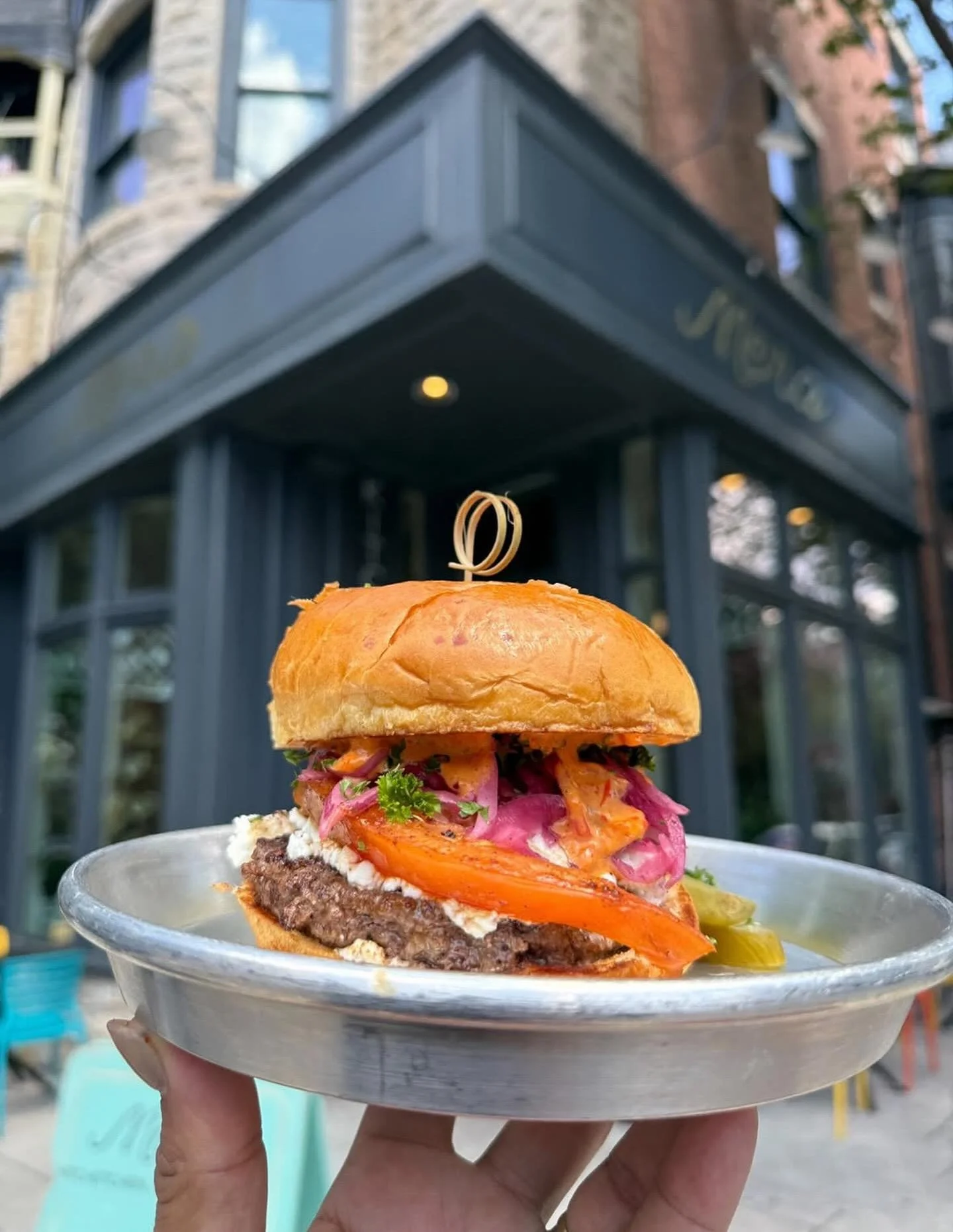 We heard it&rsquo;s #nationalcheeseburgerday tomorrow. Our Kofta Burger for your consideration: a Kofta seasoned beef patty, griddled beefsteak tomato, sumac onion &amp; parsley, spicy shatta mayo, and then top it with goat cheese. 

📸 @thebaltimore