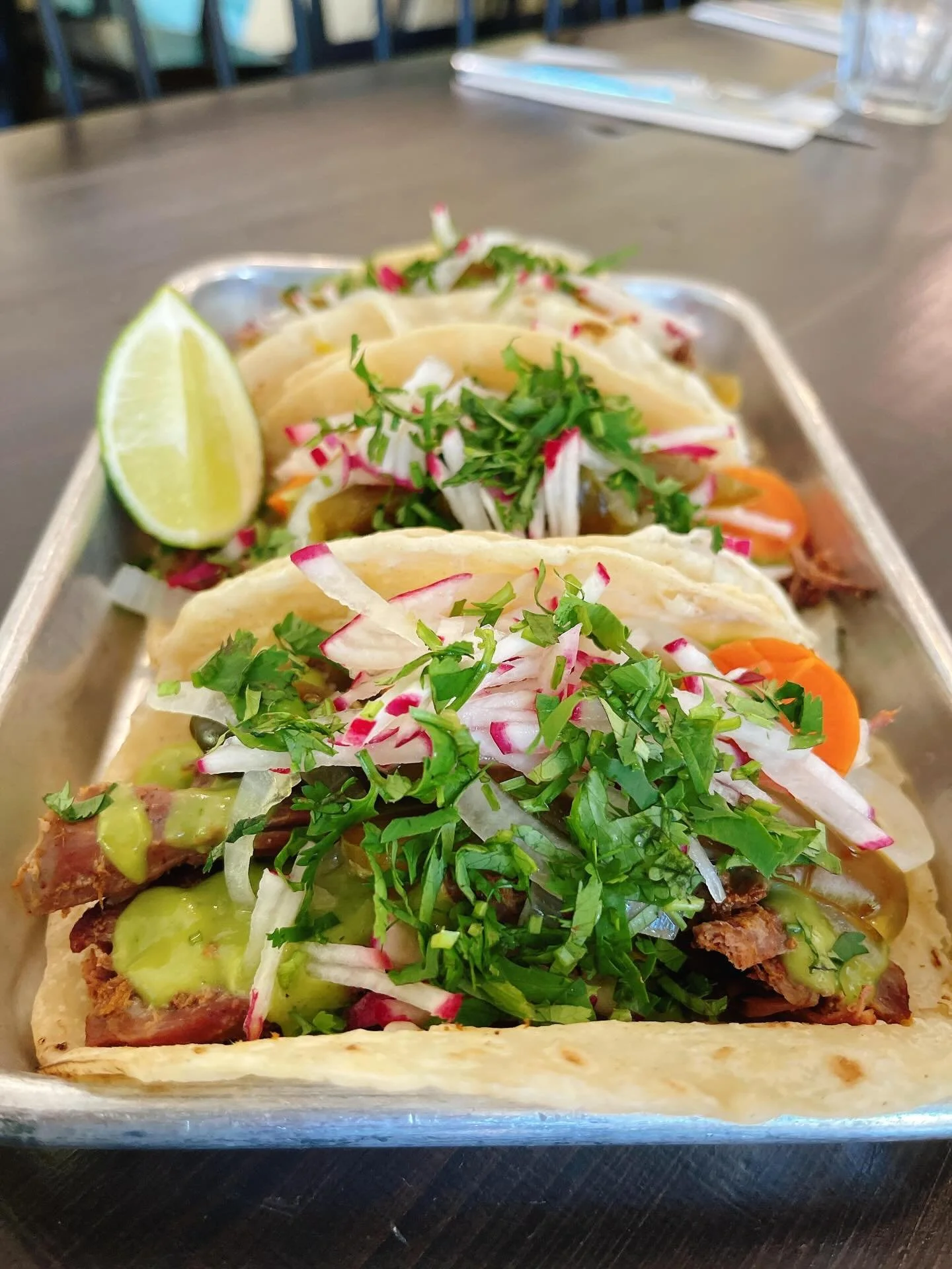 Cinco de Mayo Special: Lamb barbacoa tacos! Pulled lamb leg, slow cooked in Iris&rsquo;s chile adobo marinade, avocado salsa and jalape&ntilde;o pickles. Available all day!