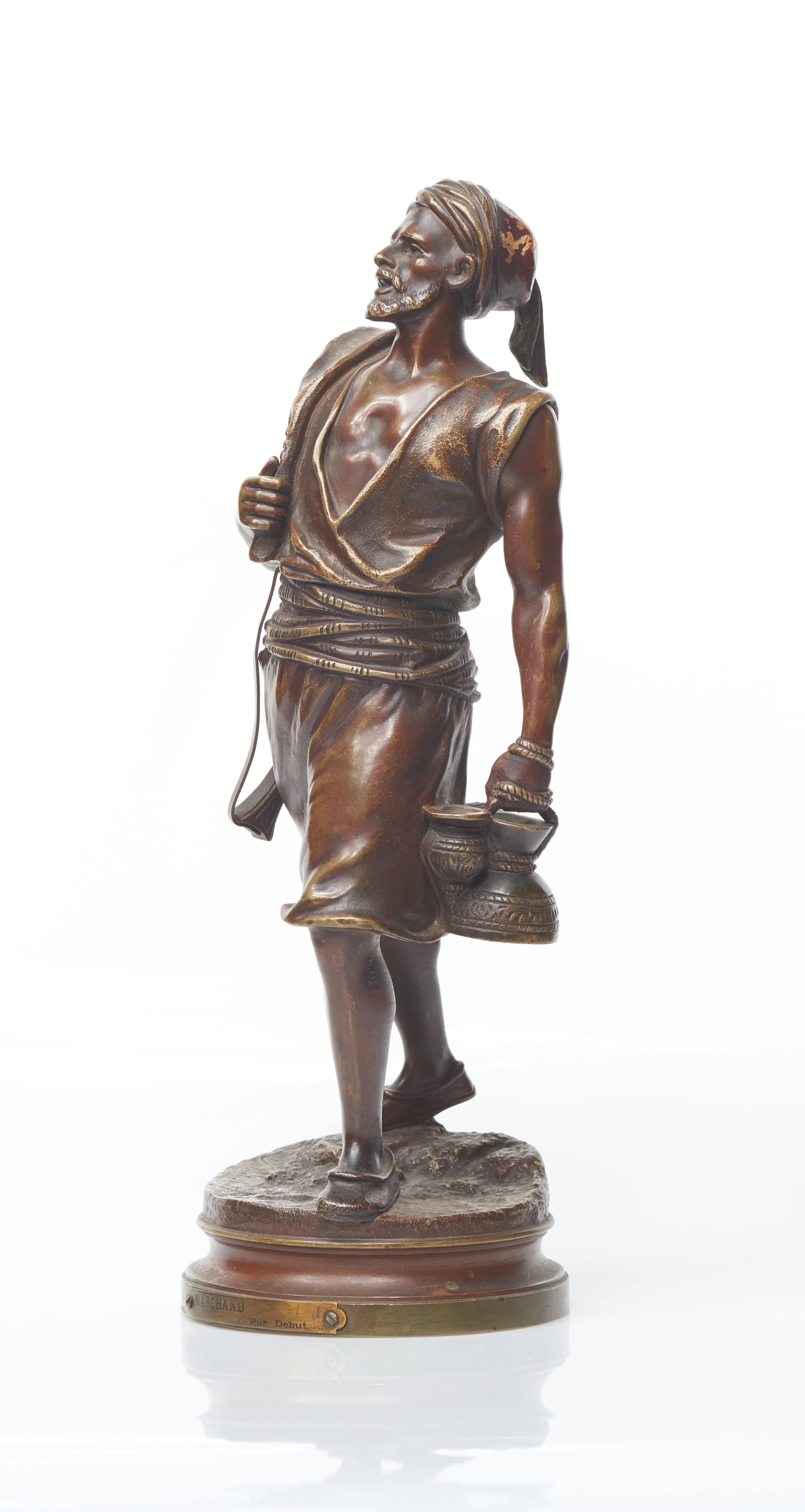 A Marcel Debut Orientalist bronze sculpture of a trader 