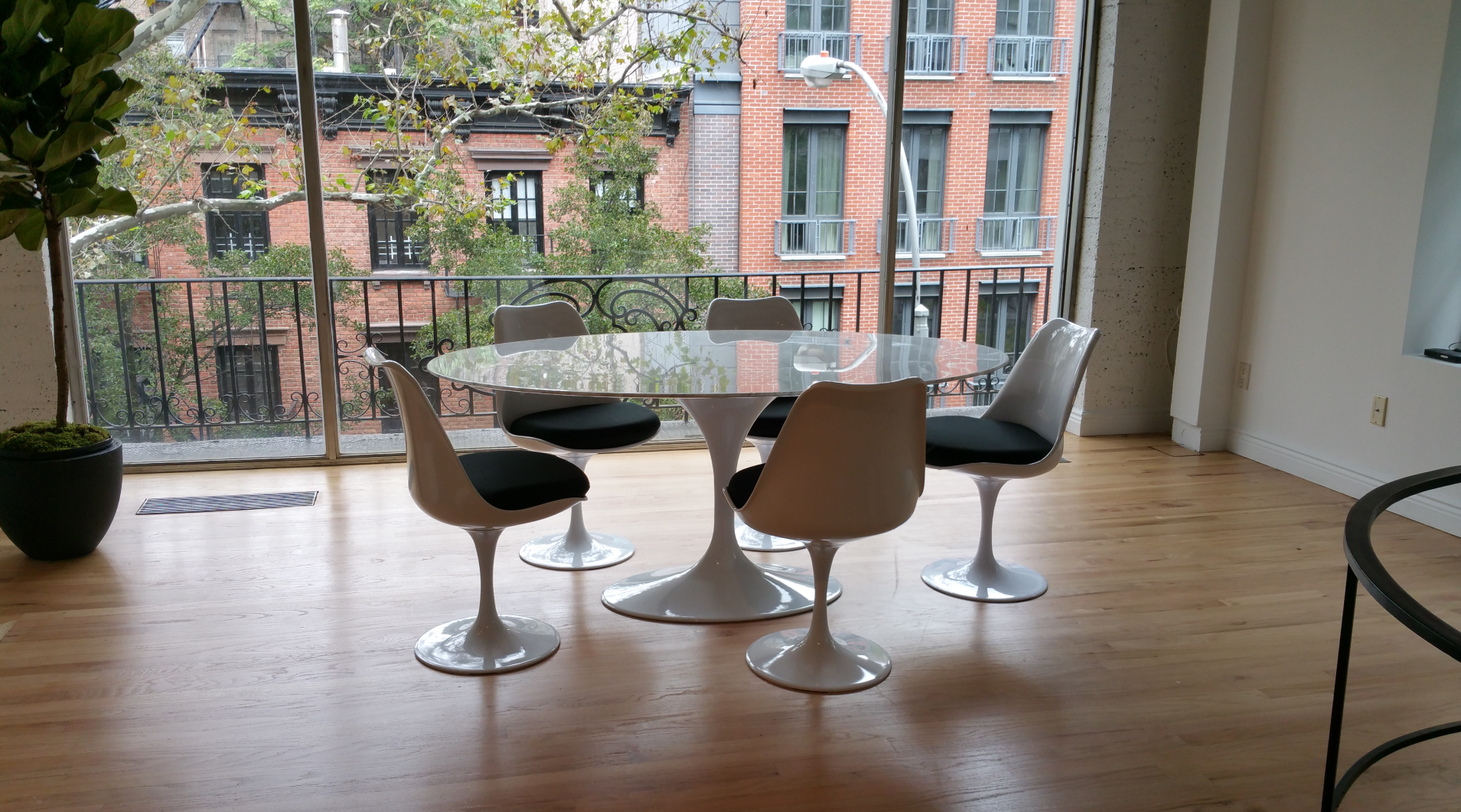 Oval Carrara Marble Tulip Saarinen Dining Table and tulip style reproduction chairs