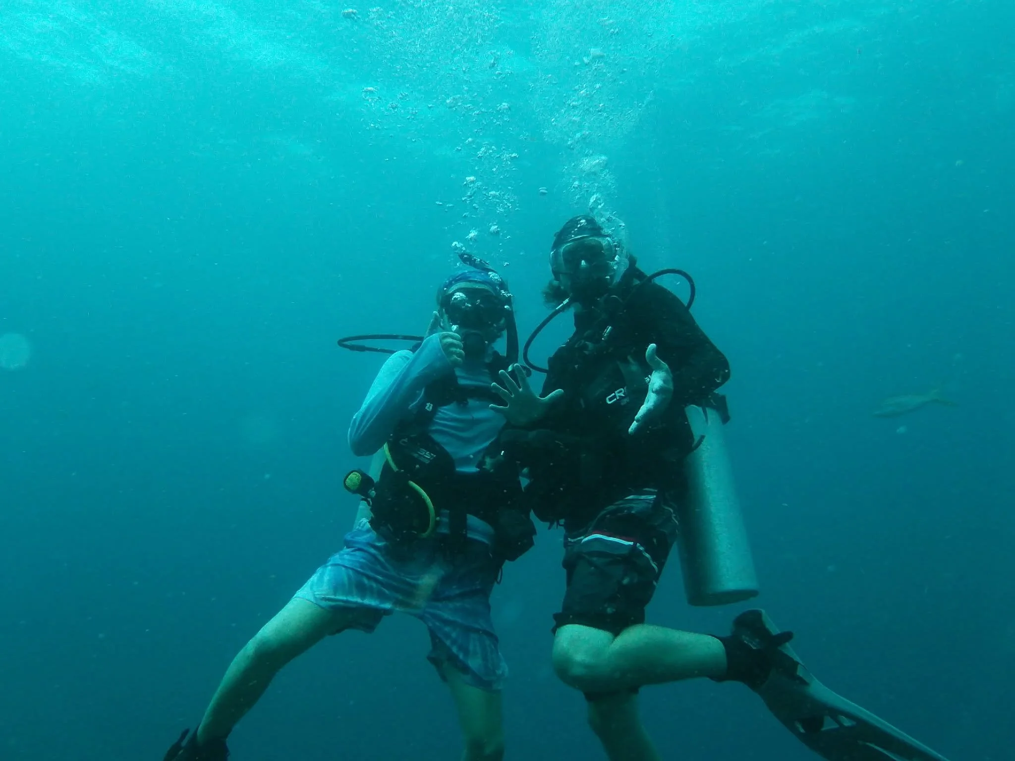 Father and son scuba diving in San Pedro, Ambergris Caye, Belize