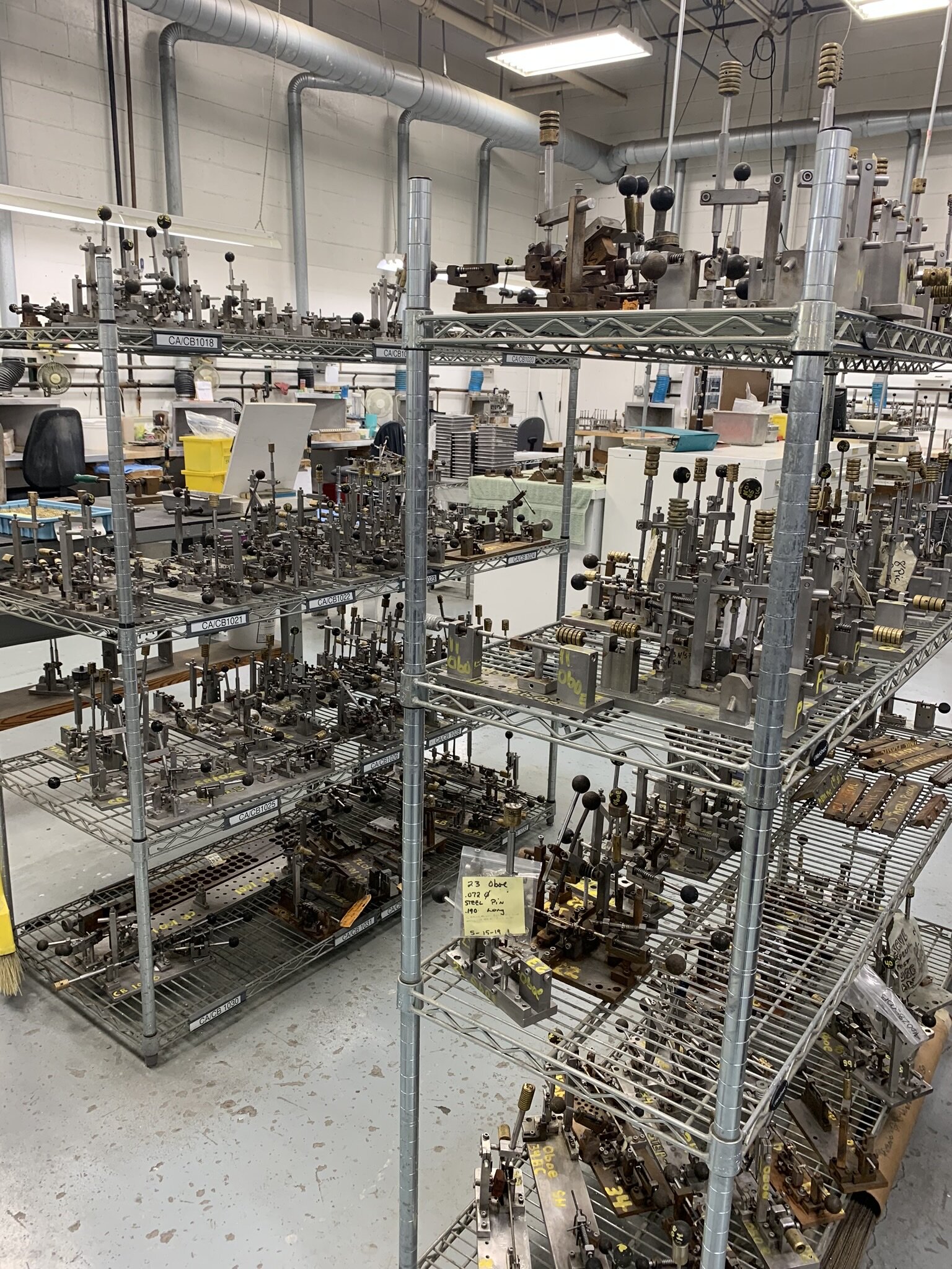 In order to work and hold the tiny key work, a custom vice is made for each type of key. This allows the key to be held precisely so that the technician can solder the springs onto each individual key.