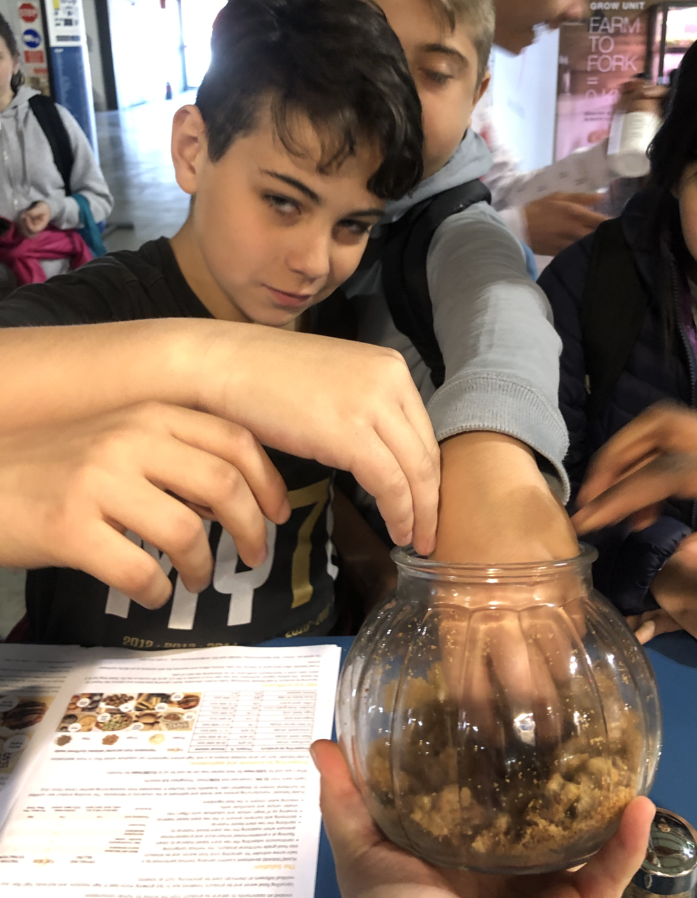 Kids+sampling+cookies+from+PLANETARIANS+ingredients+at+SeedsAndChips+2019.png