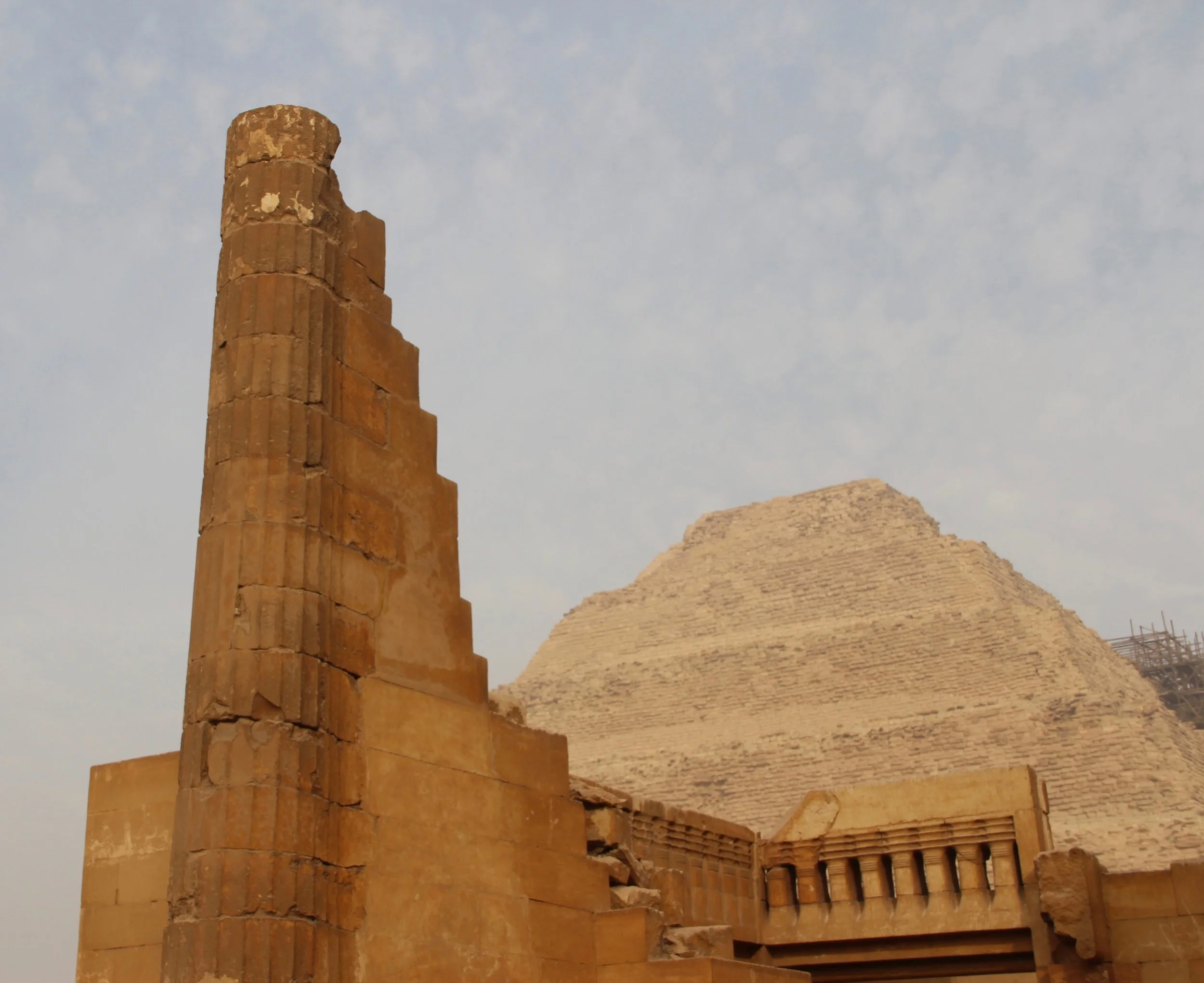 Dramatic columns and detailed balustrades surround the Step Pyramid
