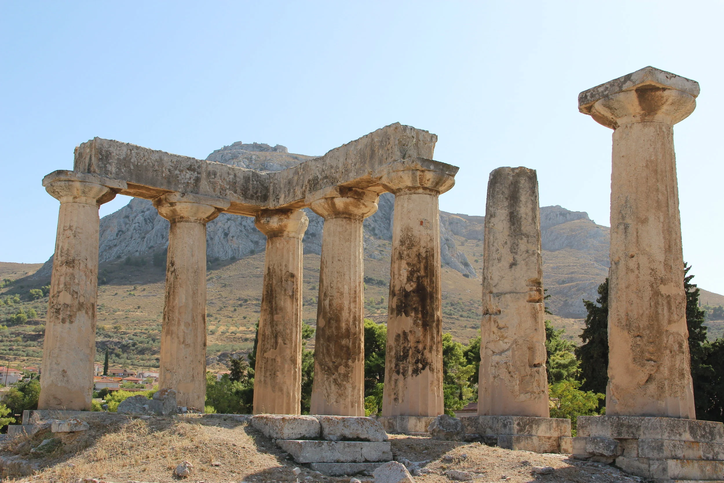 The ancient Greek temple of Athena in the archeological site of Corinth, below Acrocorinth