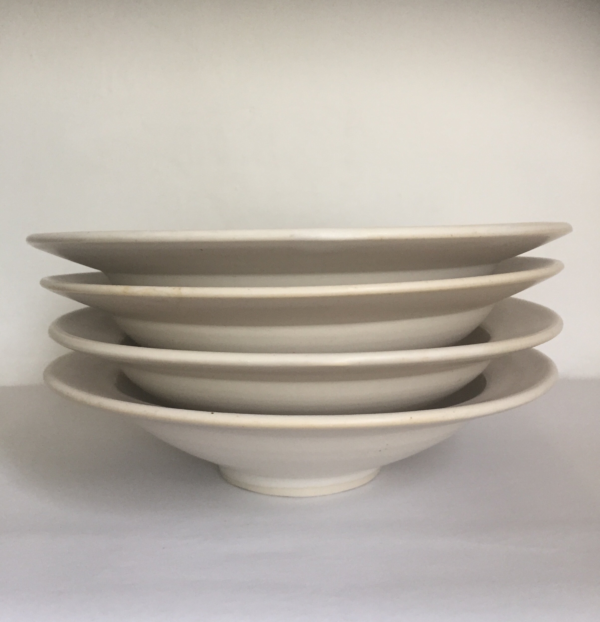 Wide rimmed shallow bowls