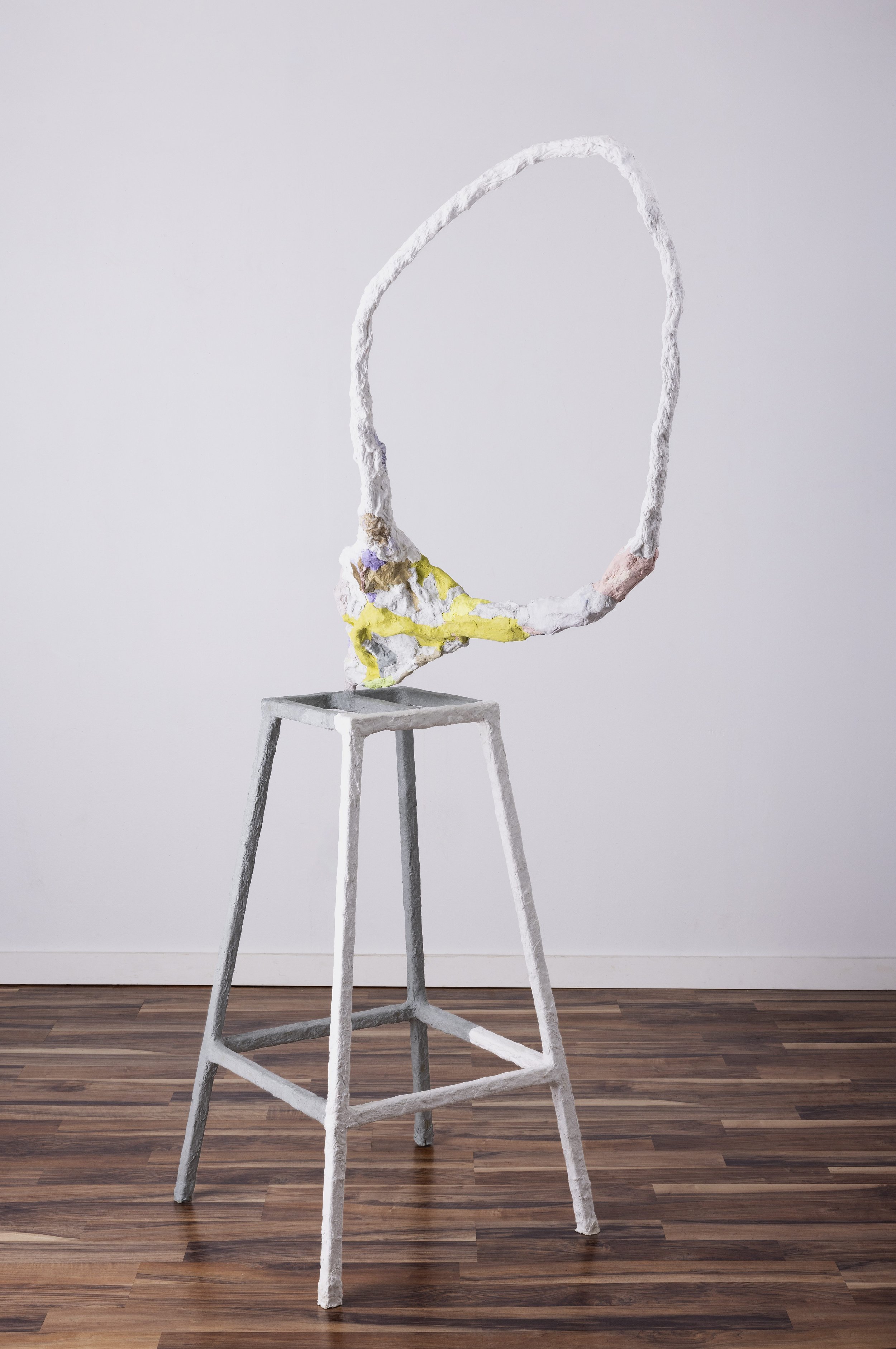 A marigold. A brick. A figure eight. 75" x 20" x 20" handmade paper, pulp paint, paper mache, steel, 2023