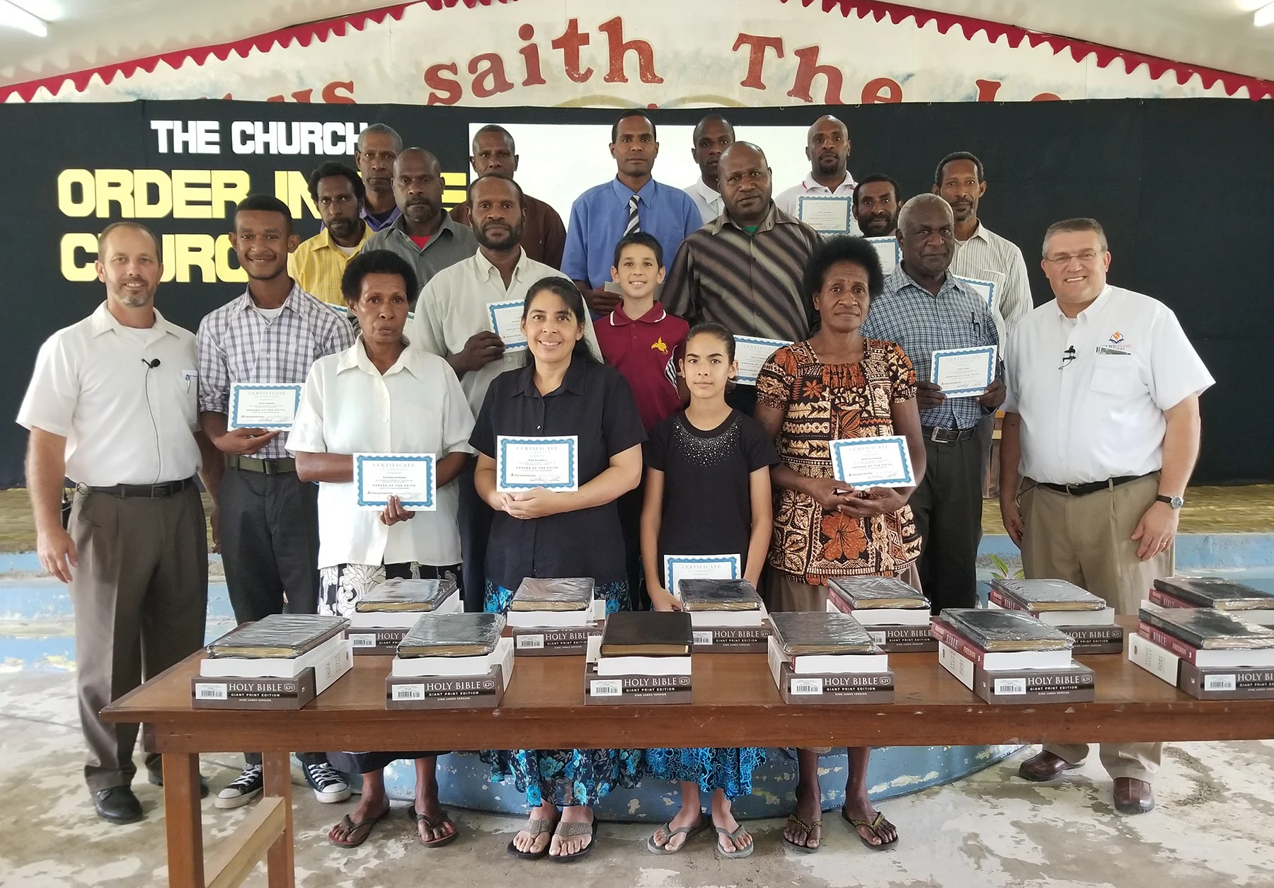 Missionary Jason Russell, Dr. Doug Brandenburg and the students of Daru Baptist Bible School
