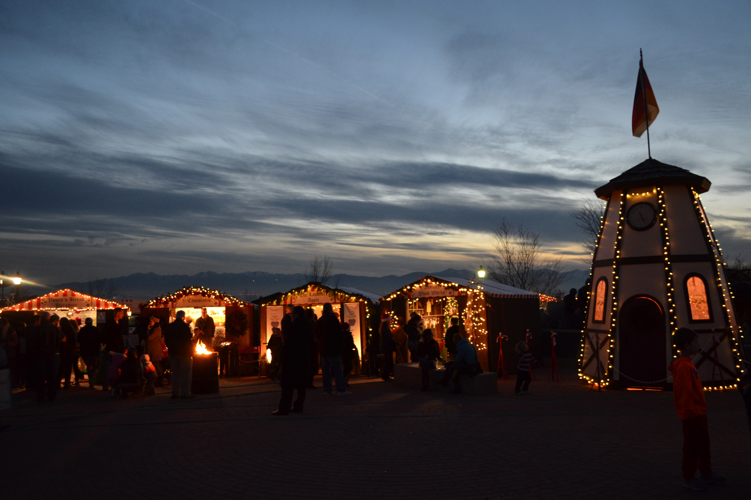 christkindlmarkt-booths-and-clock-tower-evening.jpg