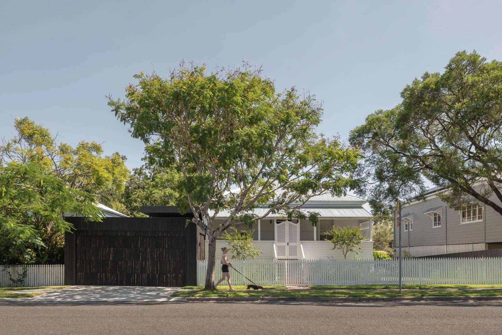 The existing low set cottage remains untouched from the street. The charred timber clad carport 'disappears' through well considered landscaping