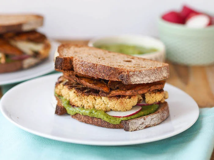 Roasted Cauliflower Sandwich with Spicy Sweet Potato Chips and Creamy Cilantro Avocado Sauce