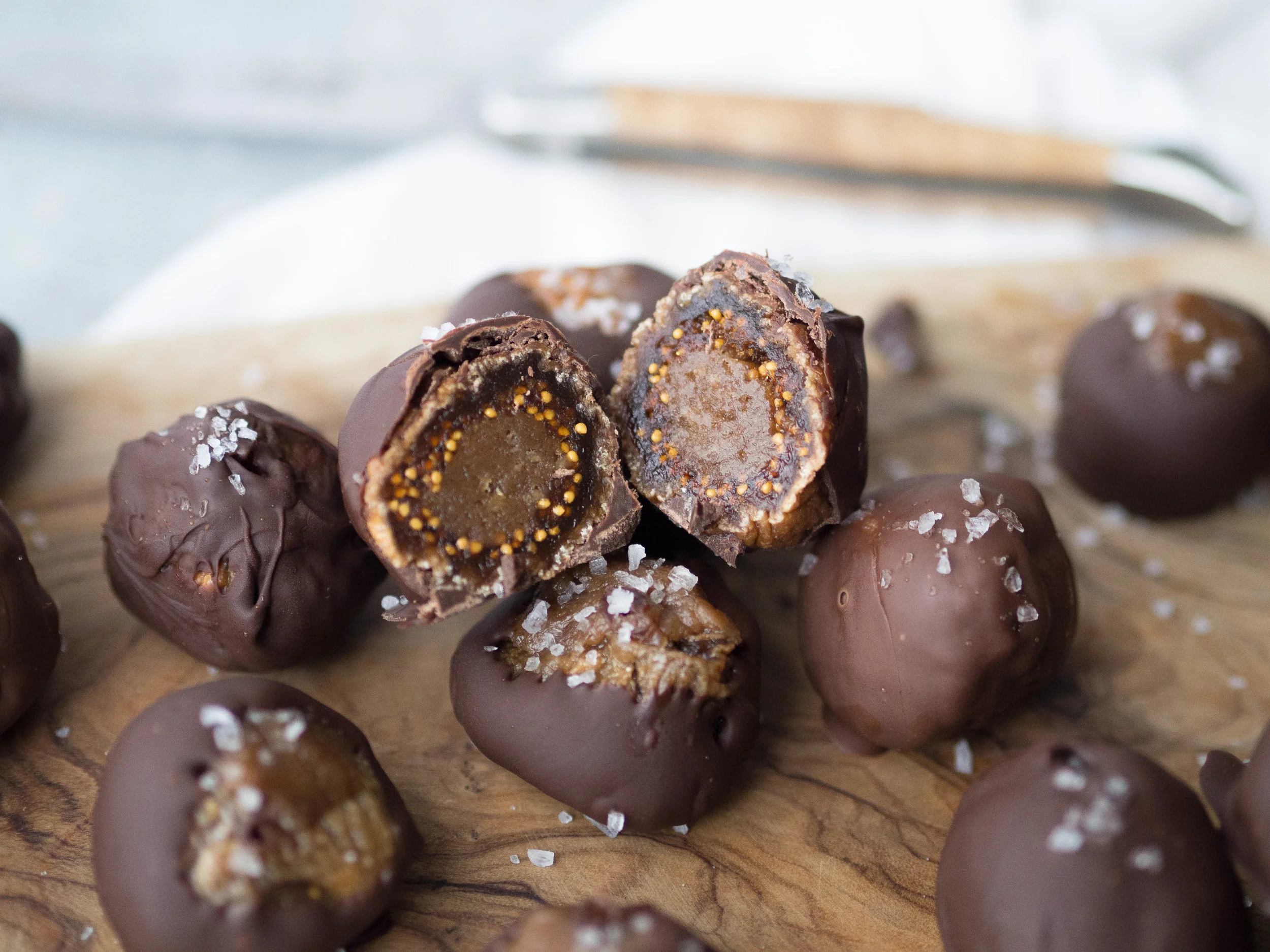 Date Caramel Stuffed Dark Chocolate Figs! Stuff chewy dried figs with an easy two ingredient date caramel, dip in dark chocolate and sprinkle with sea salt! You won’t believe how good they are! #chocolate #fig #raw #date #lowsugar #healthydessert