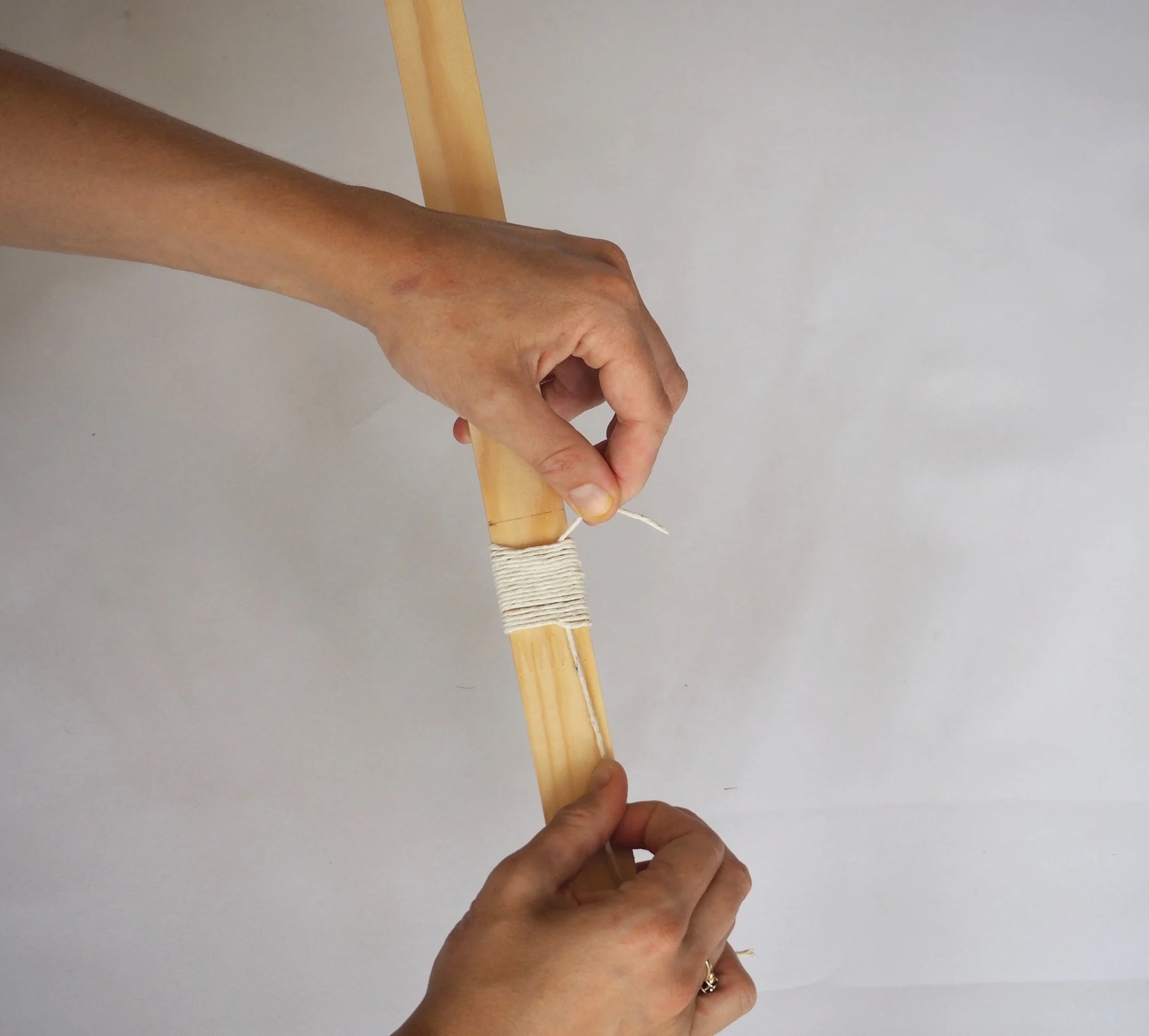  The top of the loop should now be approximately half way down the binding. 