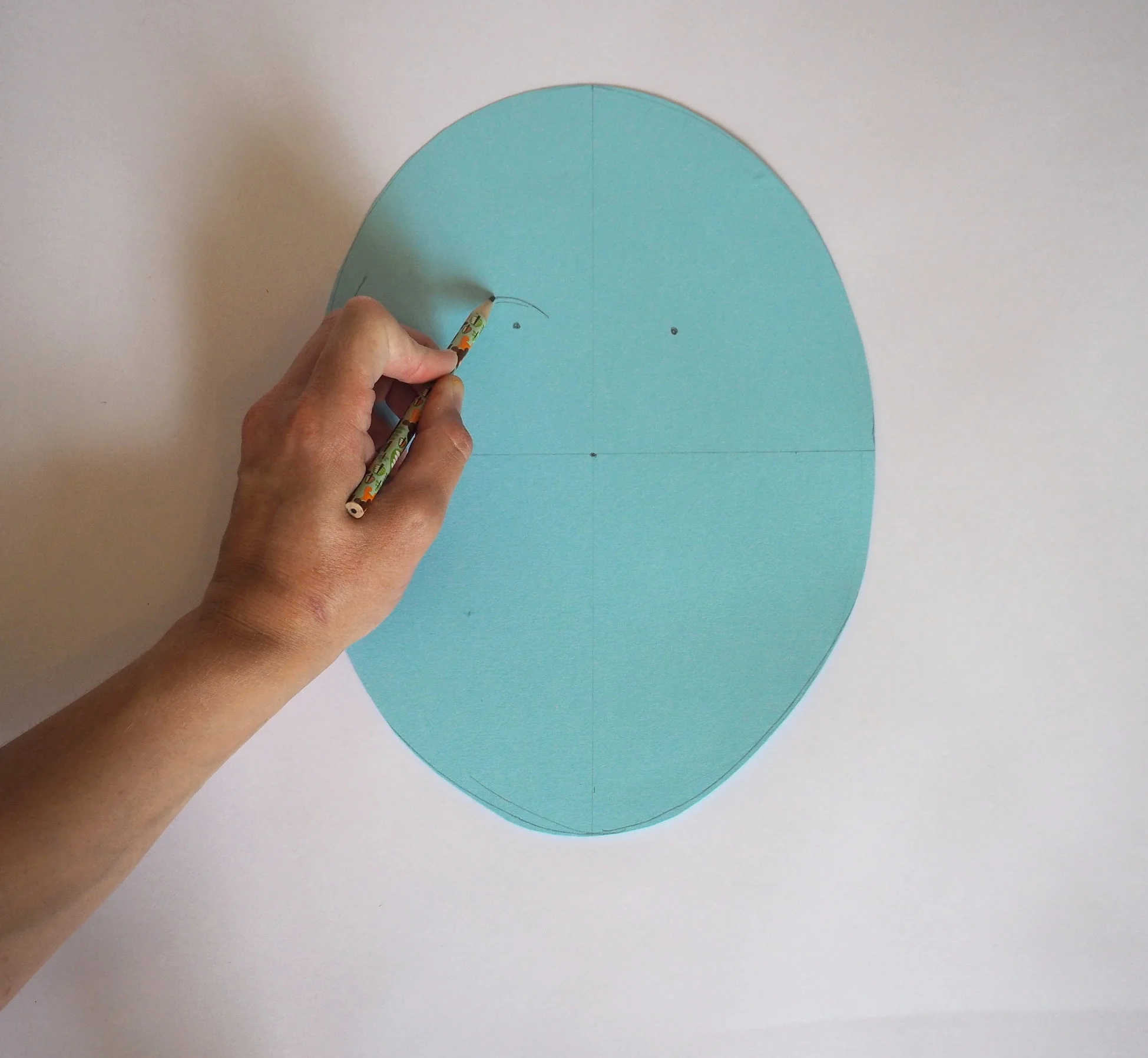  Draw the shape you would like to cut out for your eye holes. 