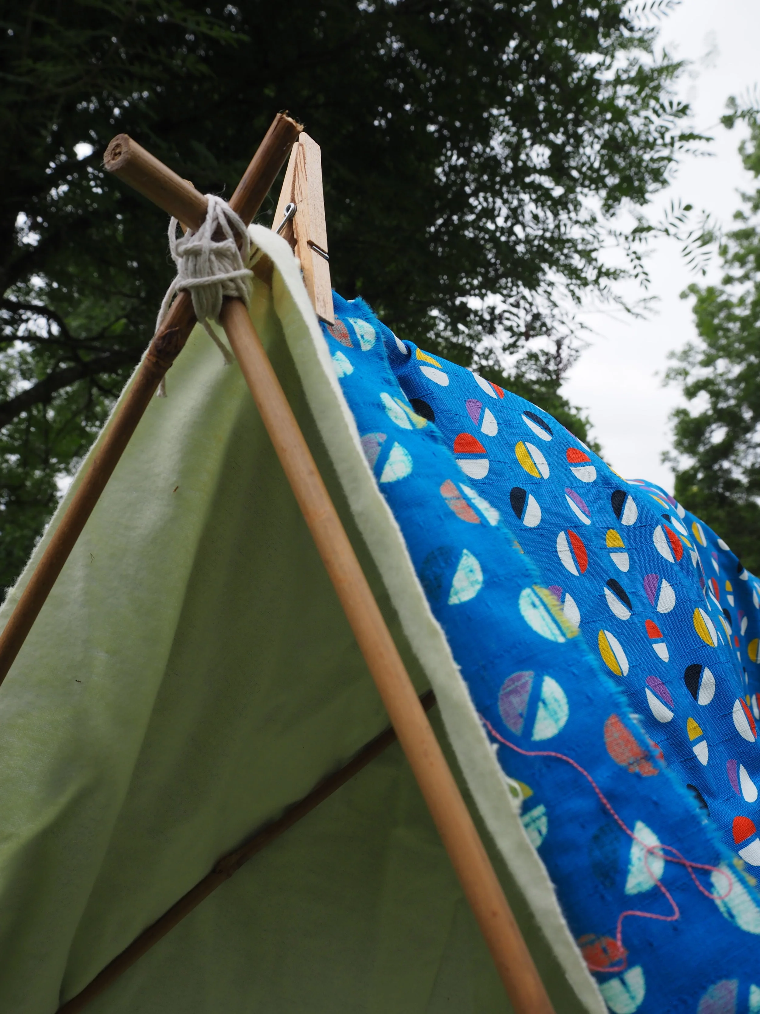  You can now use your old sheets or fabric to cover your structure, use pegs to help secure the fabric in place.  