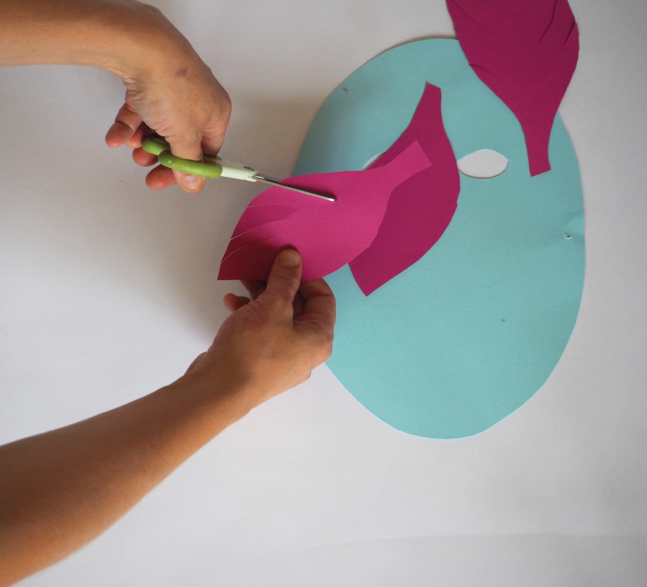  Cut slits on each side of all of the feather shapes. 