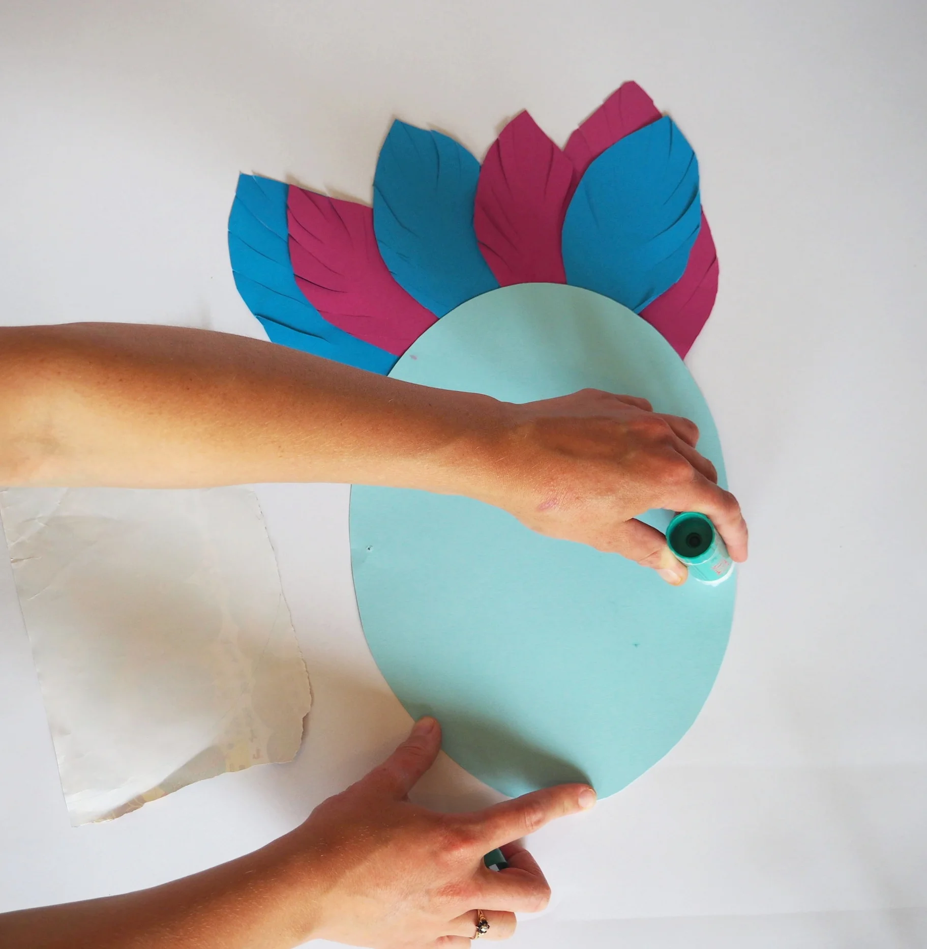  Turn mask over and apply glue to the bottom half of your mask. 