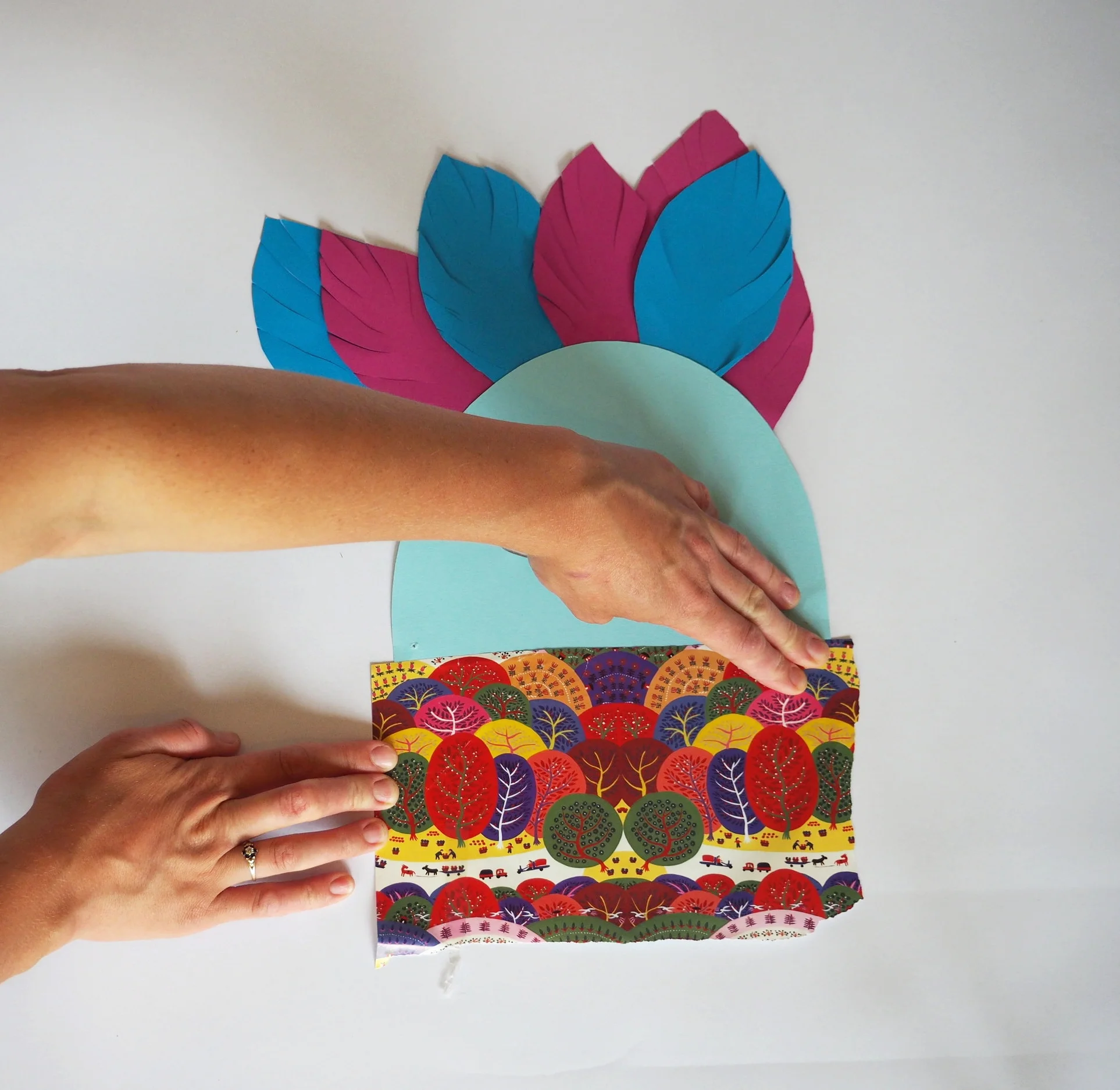  Stick your wrapping paper scrap (or another piece of patterned paper) over the glued section.  