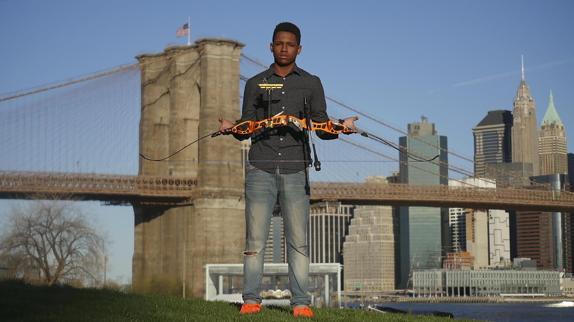 Dallas in front of the BK Bridge holding Bow.jpg