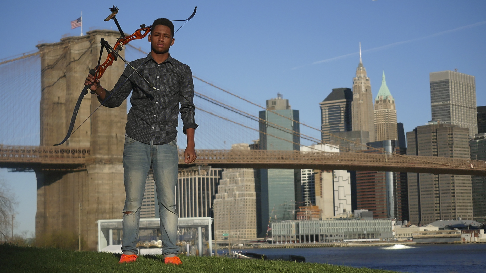Dallas in front of BK Bridge with Bow on his shoulder.JPG