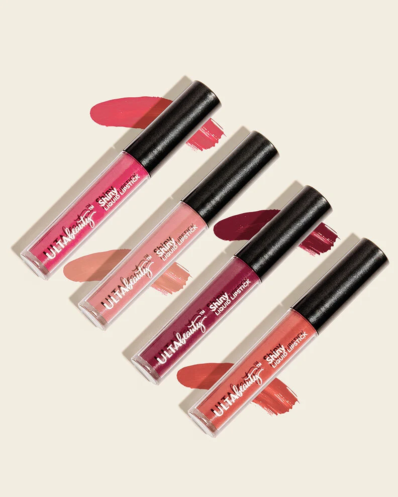 Four tubes of ULTA Beauty liquid lipstick in various shades, with swatches of each lipstick color on the background.