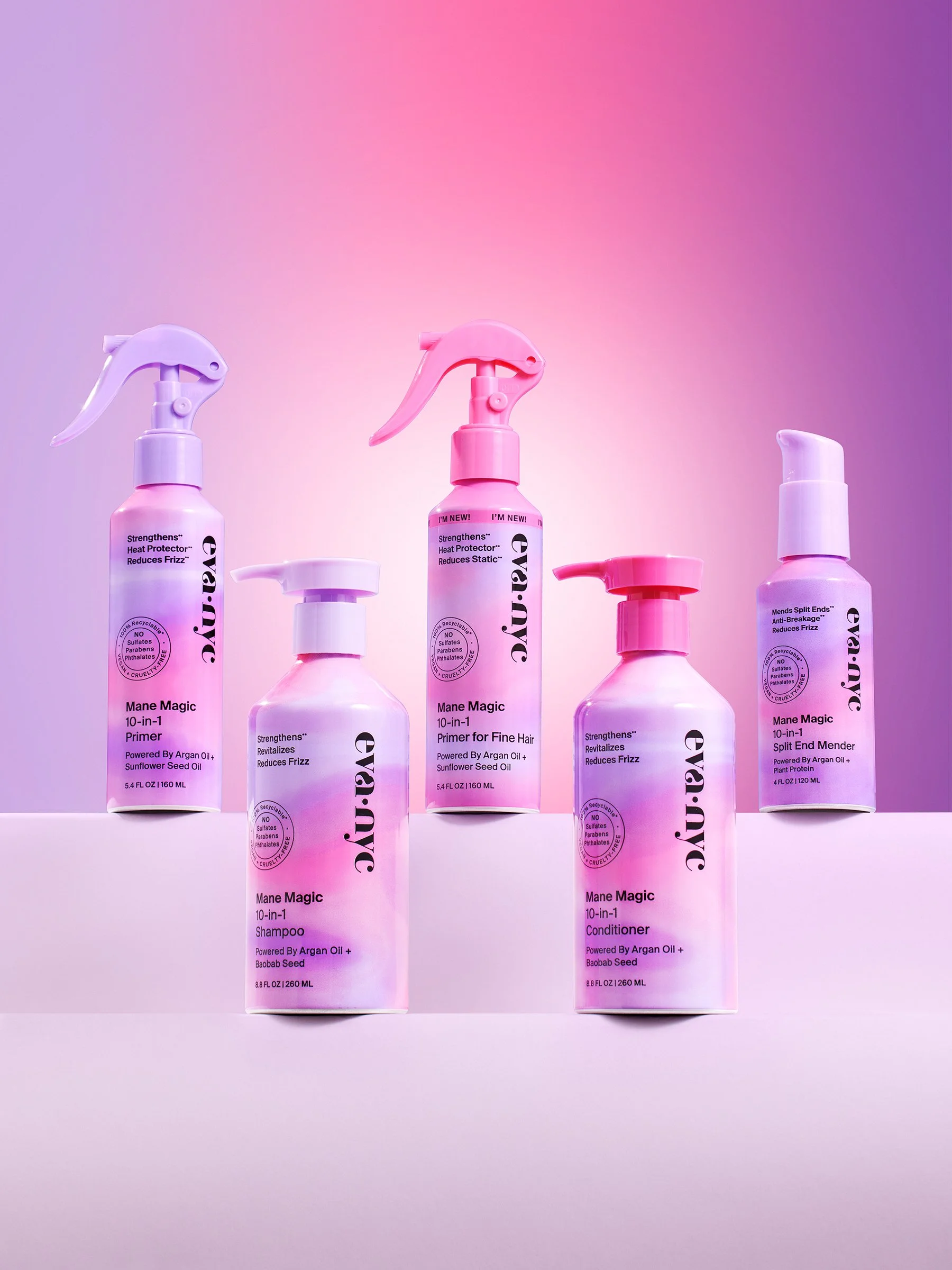 Six bottles of Mane Magic 10-in-1 hair care products in pink, purple, and white bottles with spray and pump dispensers, displayed on a pastel background.