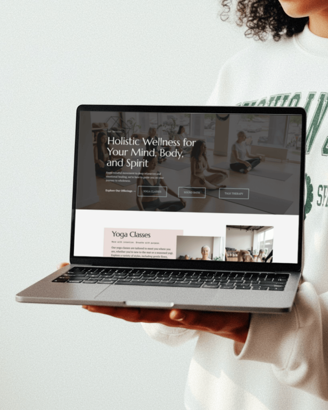 Yoga Studio website displayed on a laptop