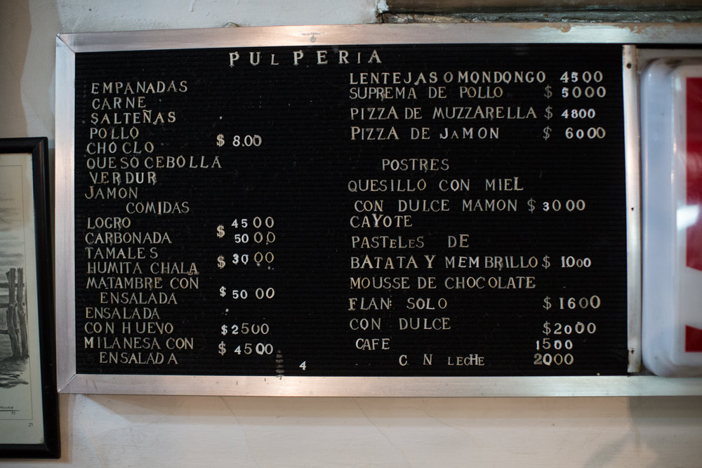  The food side of the menu. At black market rates, US $1 got us AR $8.5 (in 2014). Empanadaas listed top left. 