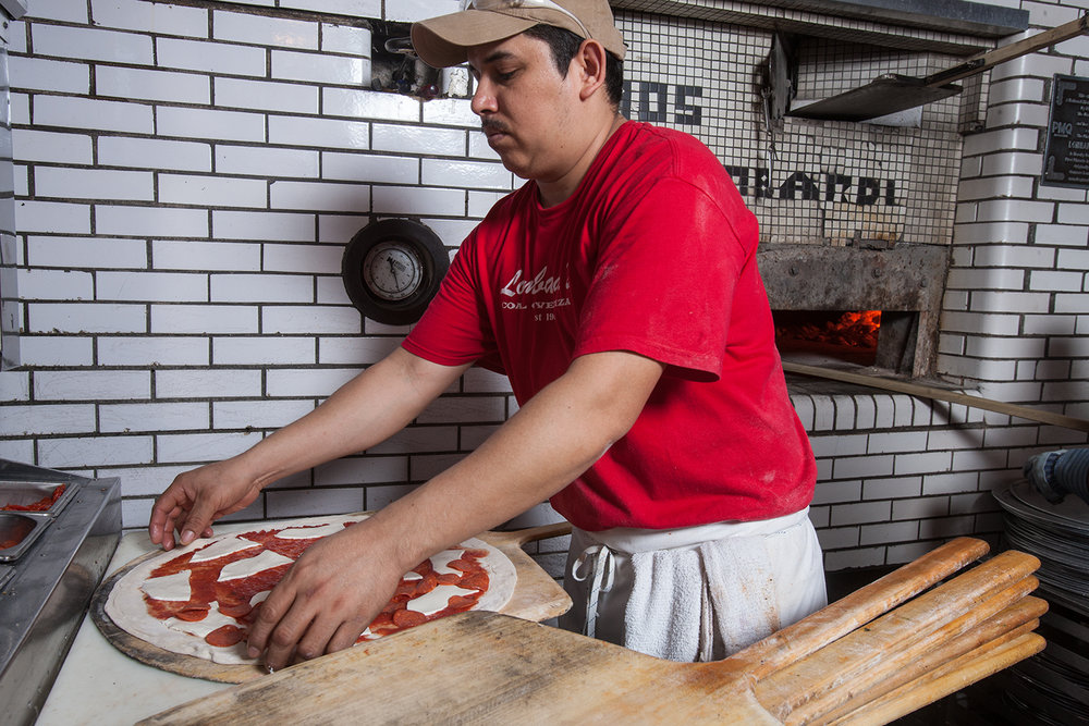  On its surface, a Lombardi's pizza is a simple thing: dough, tomatoes, fresh mozzarella, and basil... 