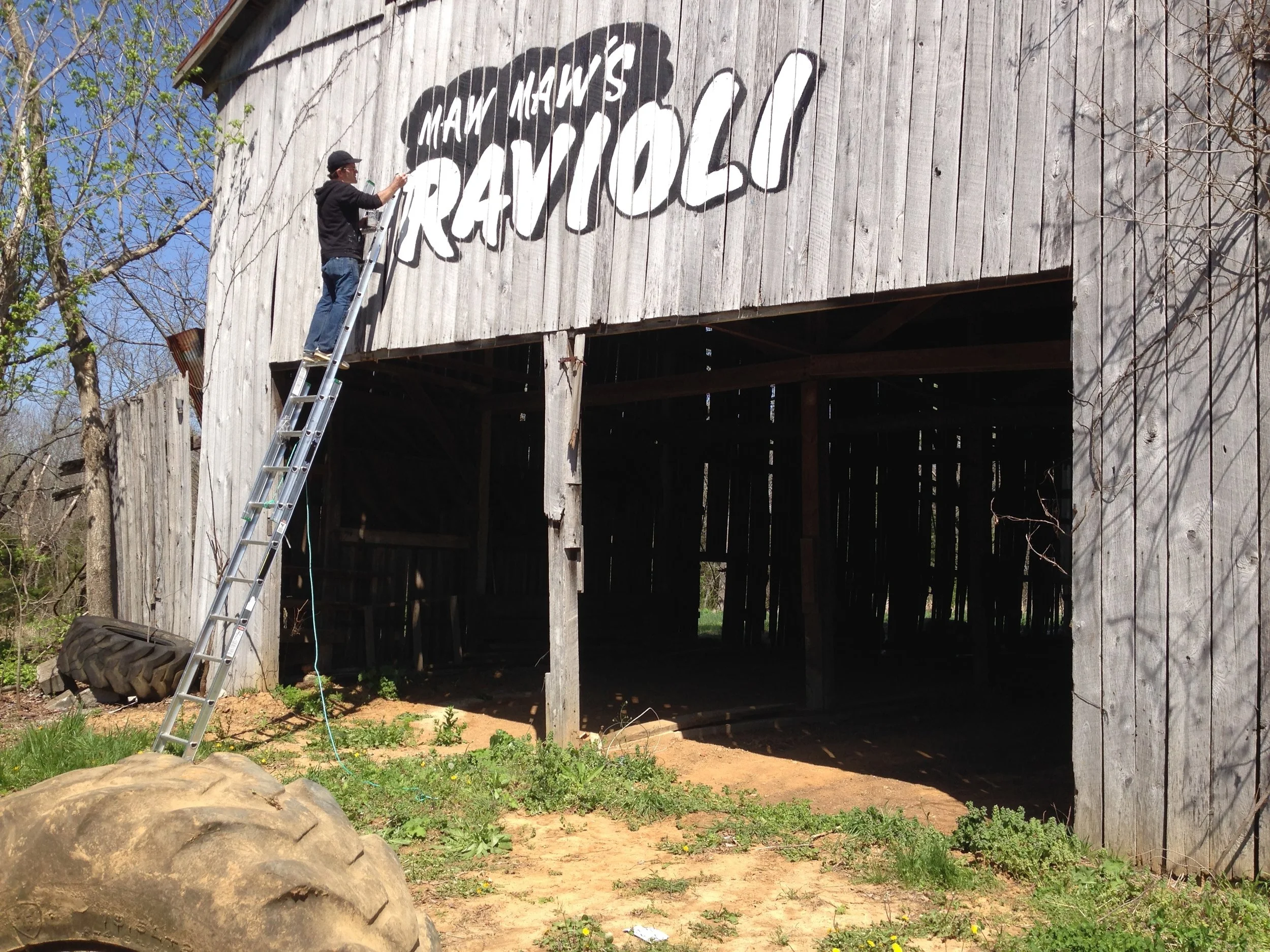 painting Maw Maw's Ravioli on a barn in Kentucky