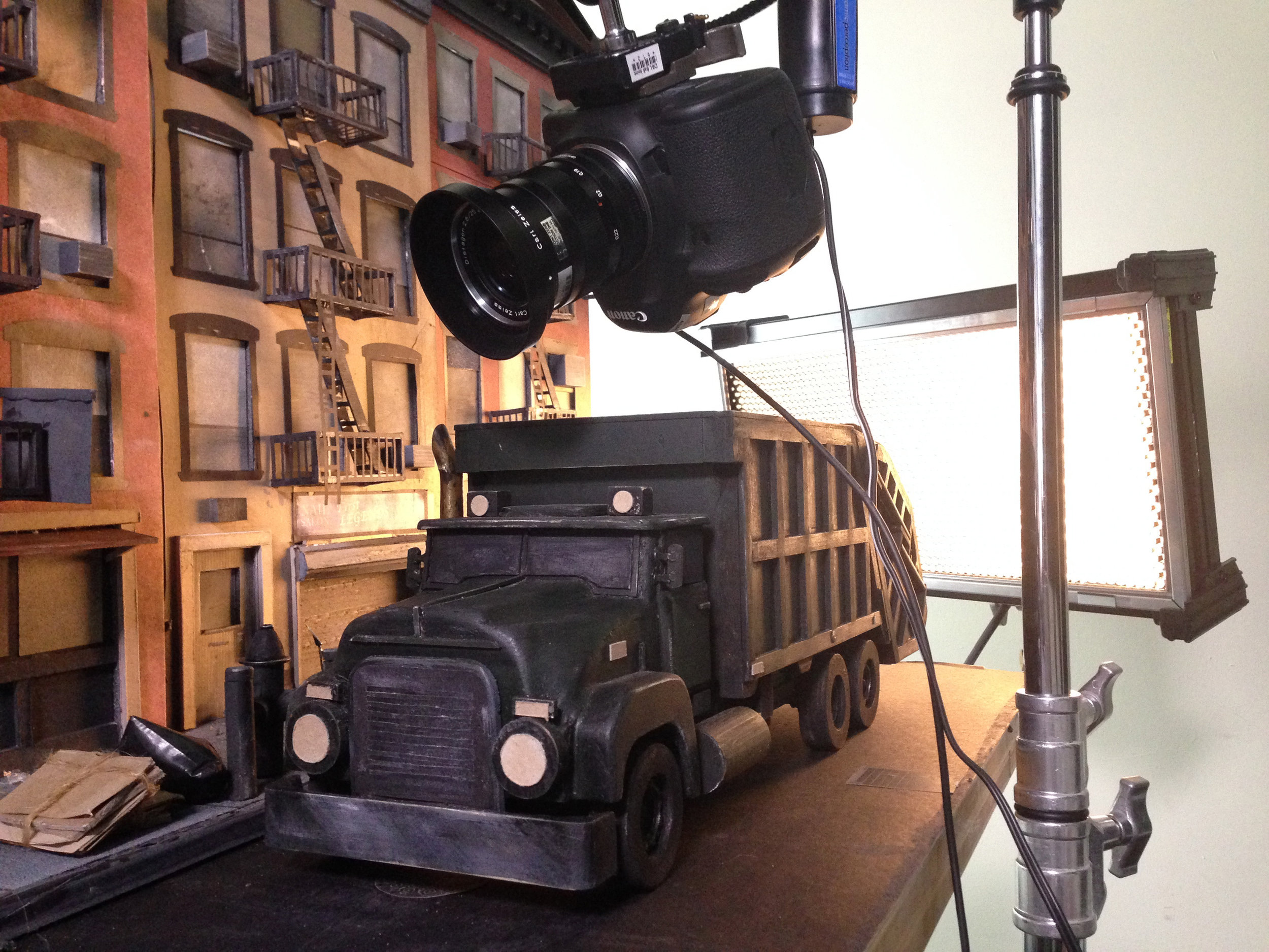 Work in progress: filing a stop motion sequence of a miniature garbage truck and city block