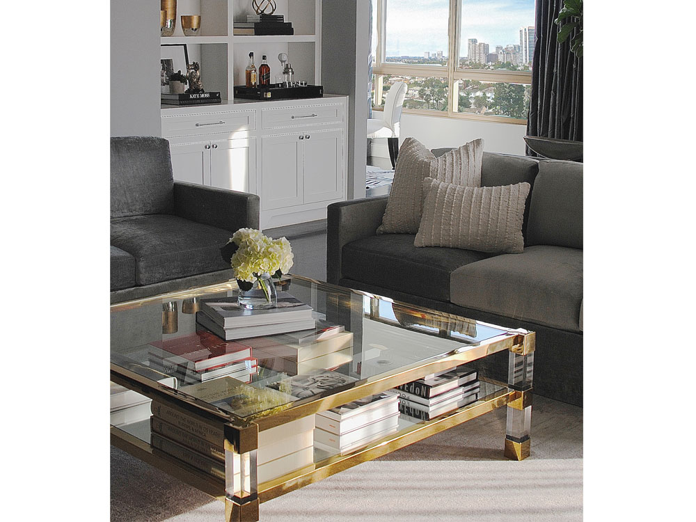 A lucite coffee table in a Saghian-designed living room.