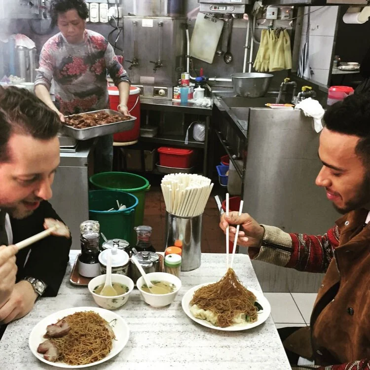 Derek Blasberg and Lewis Hamilton eating in Hong Kong for CNN Style.