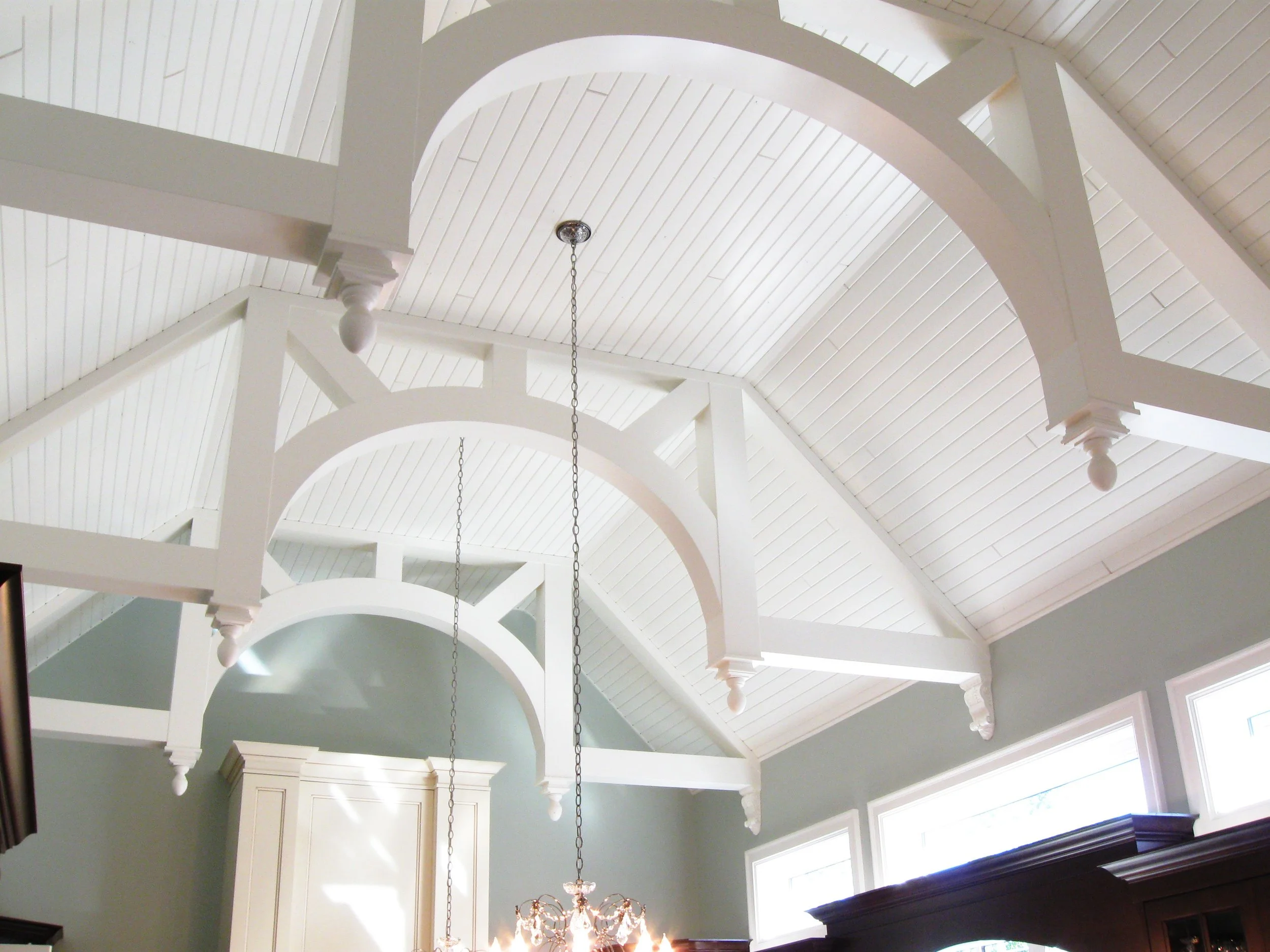 White vaulted ceiling with exposed beams in a Vancouver interior