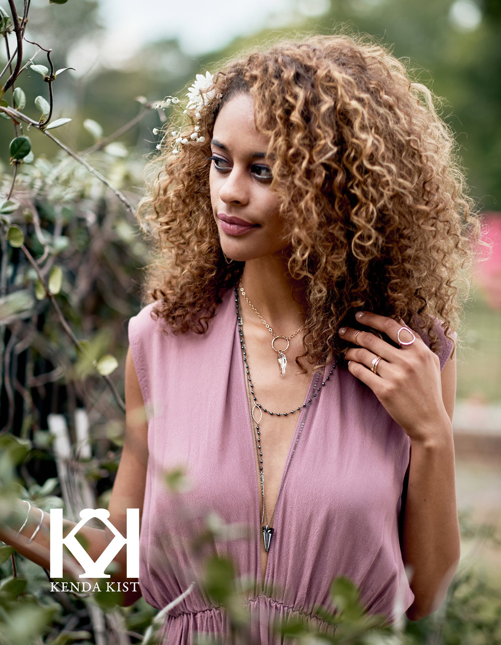 Model wears  Pegasus Necklace ,  Semi-Precious Roasry-Esque Necklace ,  Small Spike Maxi Necklace ,  Large Oval Ring ,  Thick Stackable Band ,  Wave Band , and  Faceted Cuff .