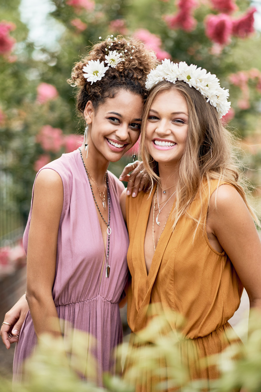 Left: Model wears  Erin Earring ,  Pegasus Necklace ,  Semi-Precious Roasry-Esque Necklace ,  Small Spike Maxi Necklace  Right: Model wears  Large Hexagon Hoops ,  Tiny Dancer ,  Lucky Charm Necklace ,  Lunar Pendant , and  Chain Lab Lariat