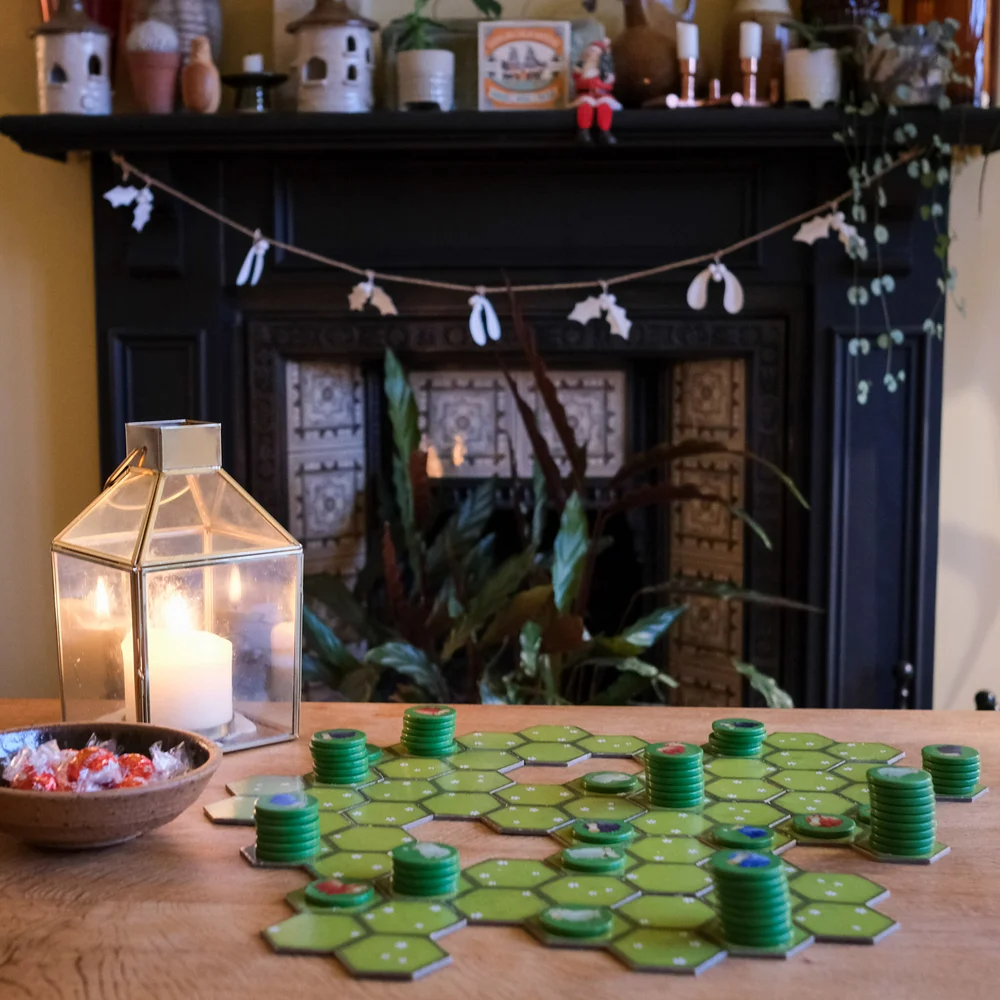 Battle Sheep board game in front of a fire place