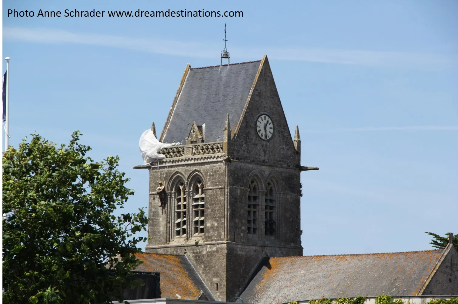 Ste. Mere Eglise church steeple with the replica of a dangling PFC John Steele