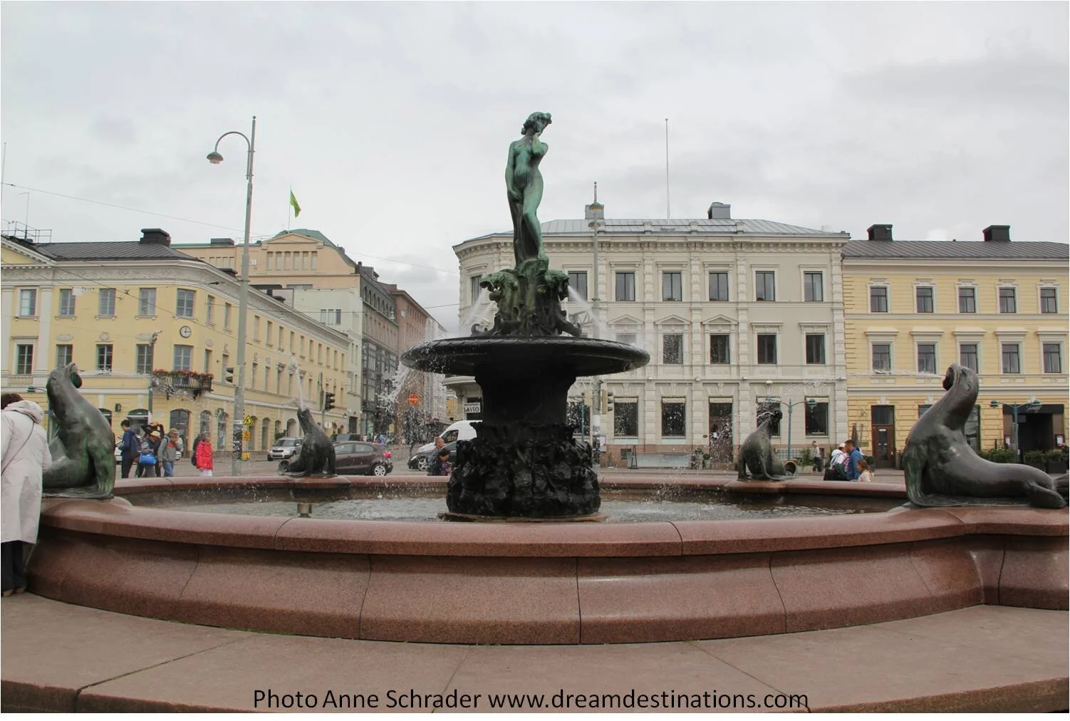 The sculpture is cast in bronze an the water basin is made from granite.  The sculpture is a mermaid rising from the water and four sea lions spouting water from their mouths.