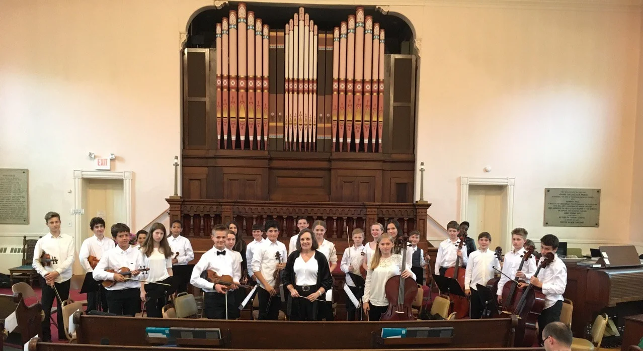 Susan conducting her middle-school orchestra students performing the Albinoni "Adagio" and Vivaldi "Gloria."
