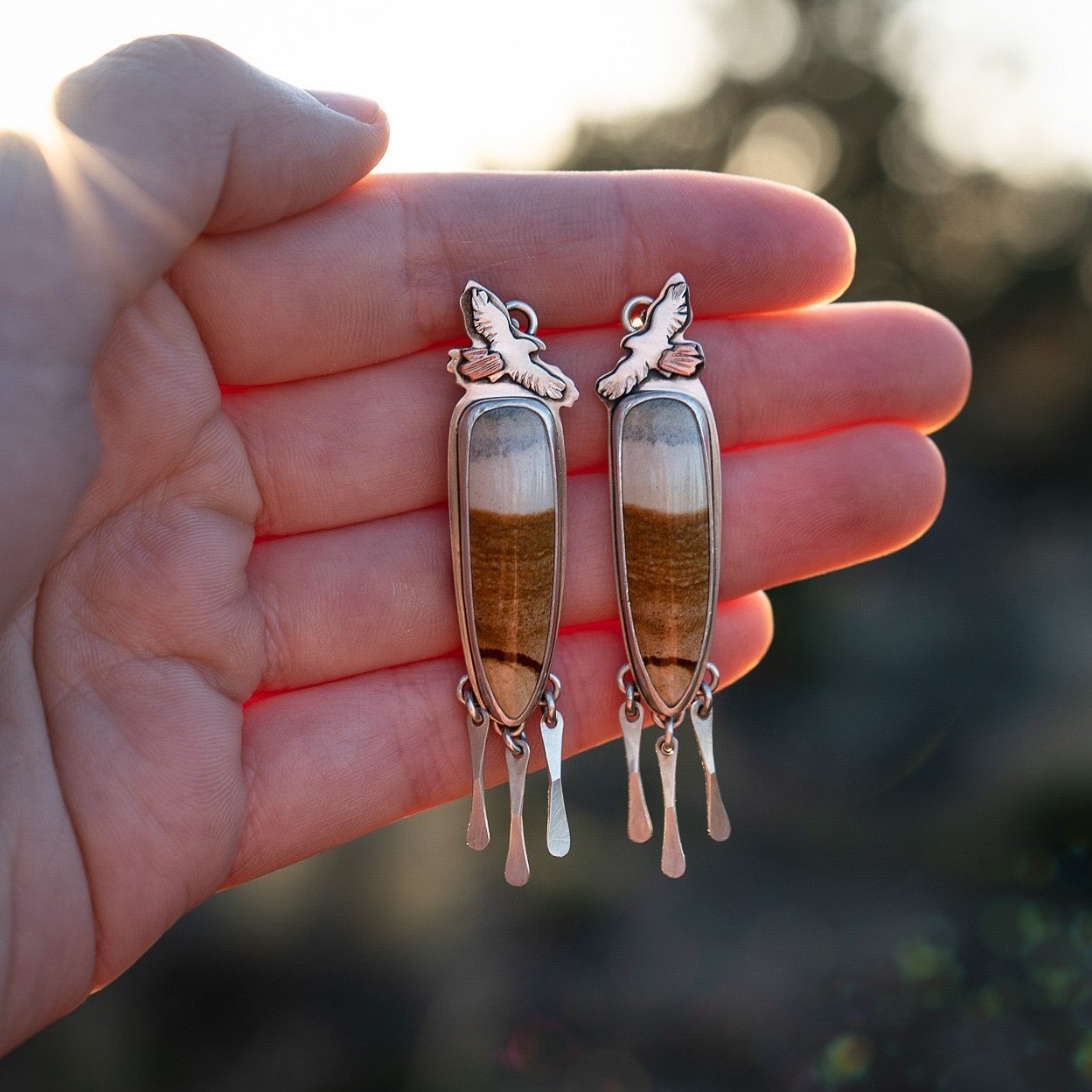 There&rsquo;s a couple red tailed hawks that fly high above my house. Every time I see them, I think how lovely it must feel to soar so effortlessly and feel the wind through your wings. 🪽 

I made these earrings in honor of them. I wanted to captur