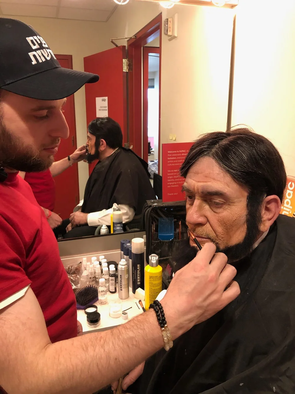 Abraham Lincoln makeup being applied