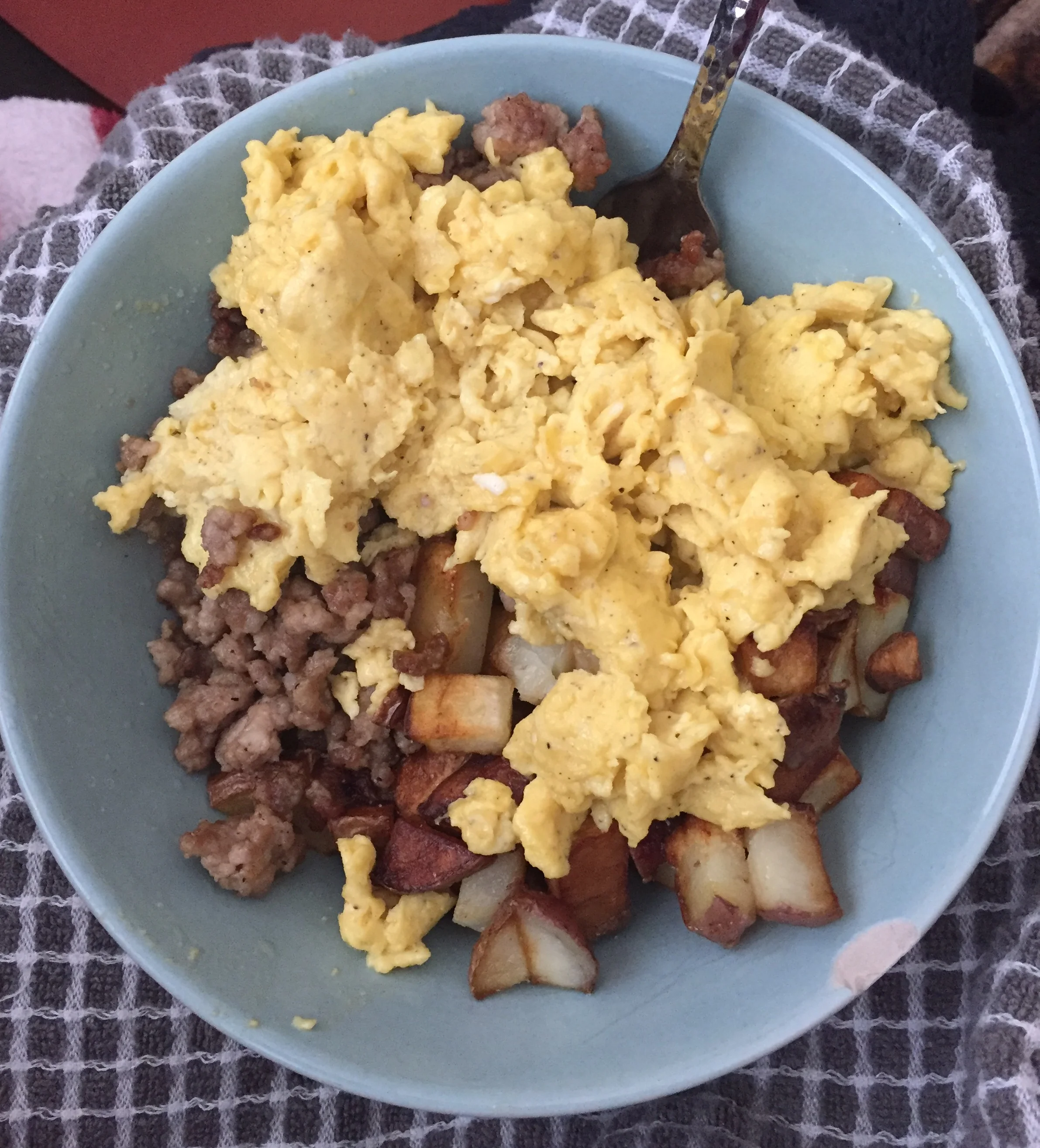 Breakfast bowl variation: Potatoes, ground pork, topped with scrambled eggs! 